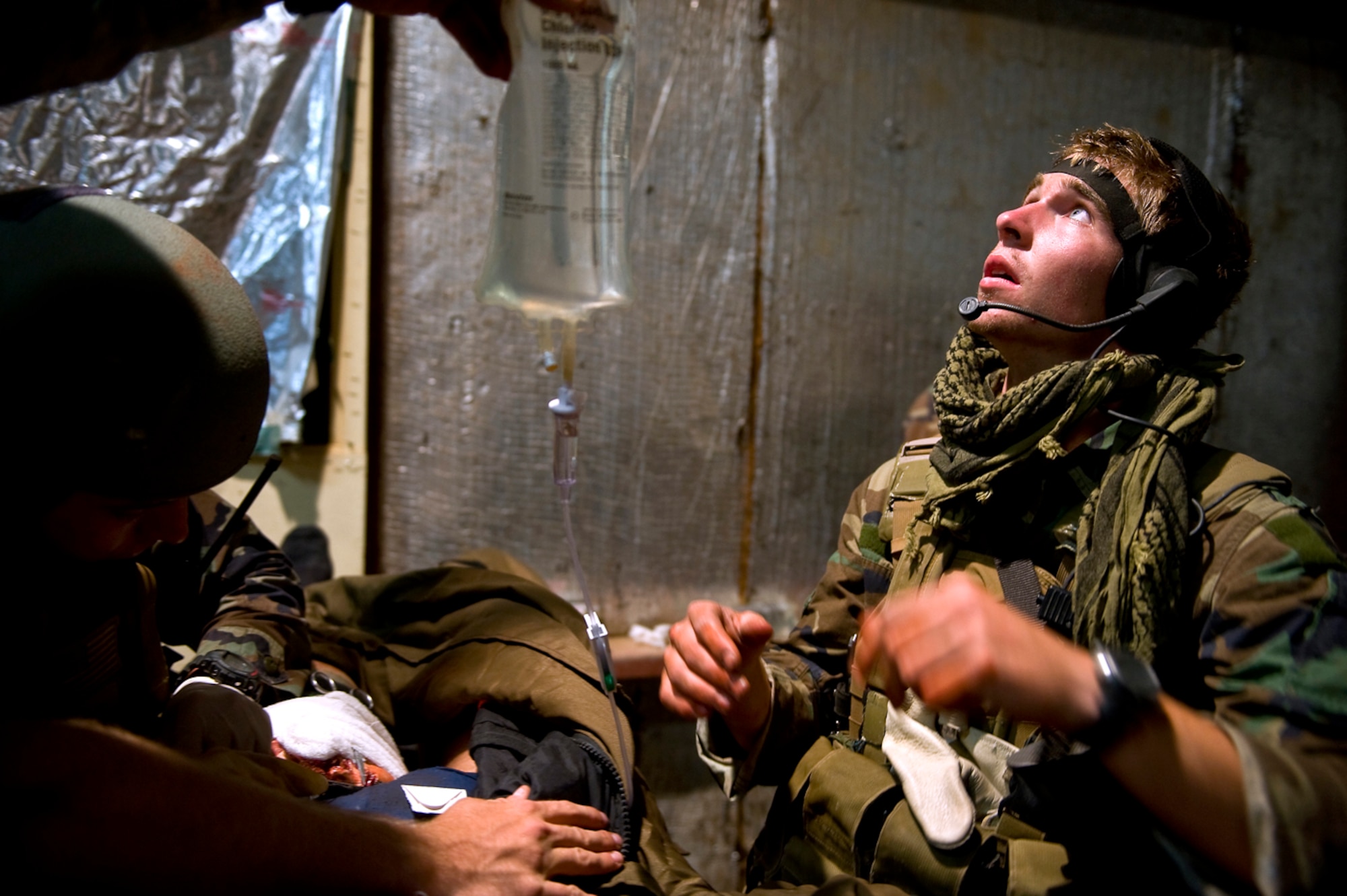 Trying to stabilize an injured helicopter pilot, Senior Airman Jackson Rogers' medical skills are tested to the limit during a field training exercise for pararescue students at Kirtland AFB, N.M. (U.S. Air Force Photo by Tech. Sgt. Matthew Hannen)
