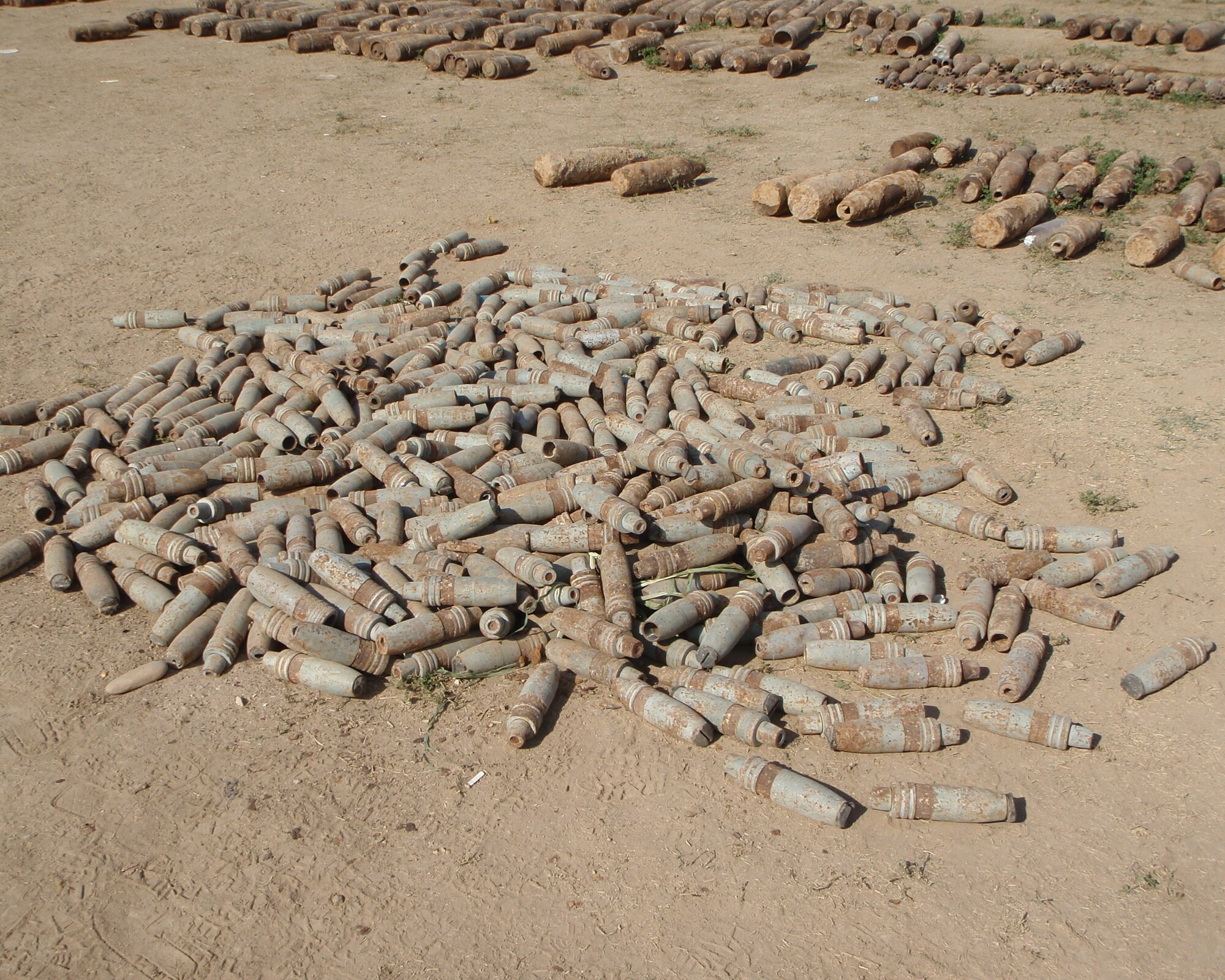 Explosive devices await destruction.  The weapons are part of a 13,000 cache destroyed by the 447th Expeditionary Civil Engineer Squadron Explosive Ordnance Disposal Alpha Flight, Sather Air Base, Iraq. (U.S. Air Force photo)  