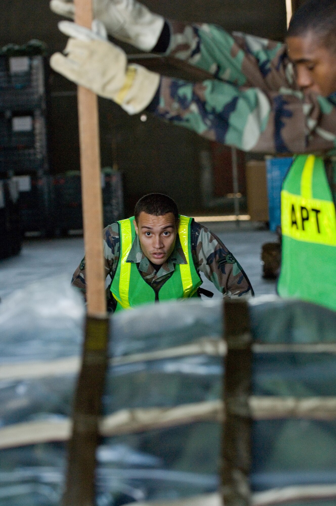 YOKOTA AIR BASE, Japan- Airman 1st Class Michael Joyner, 374th Communications Squadron, measures the pallet height during the Samurai Readiness cargo loading training here, Dec.19. (U.S. Air Force Photo by Osakabe Yasuo)