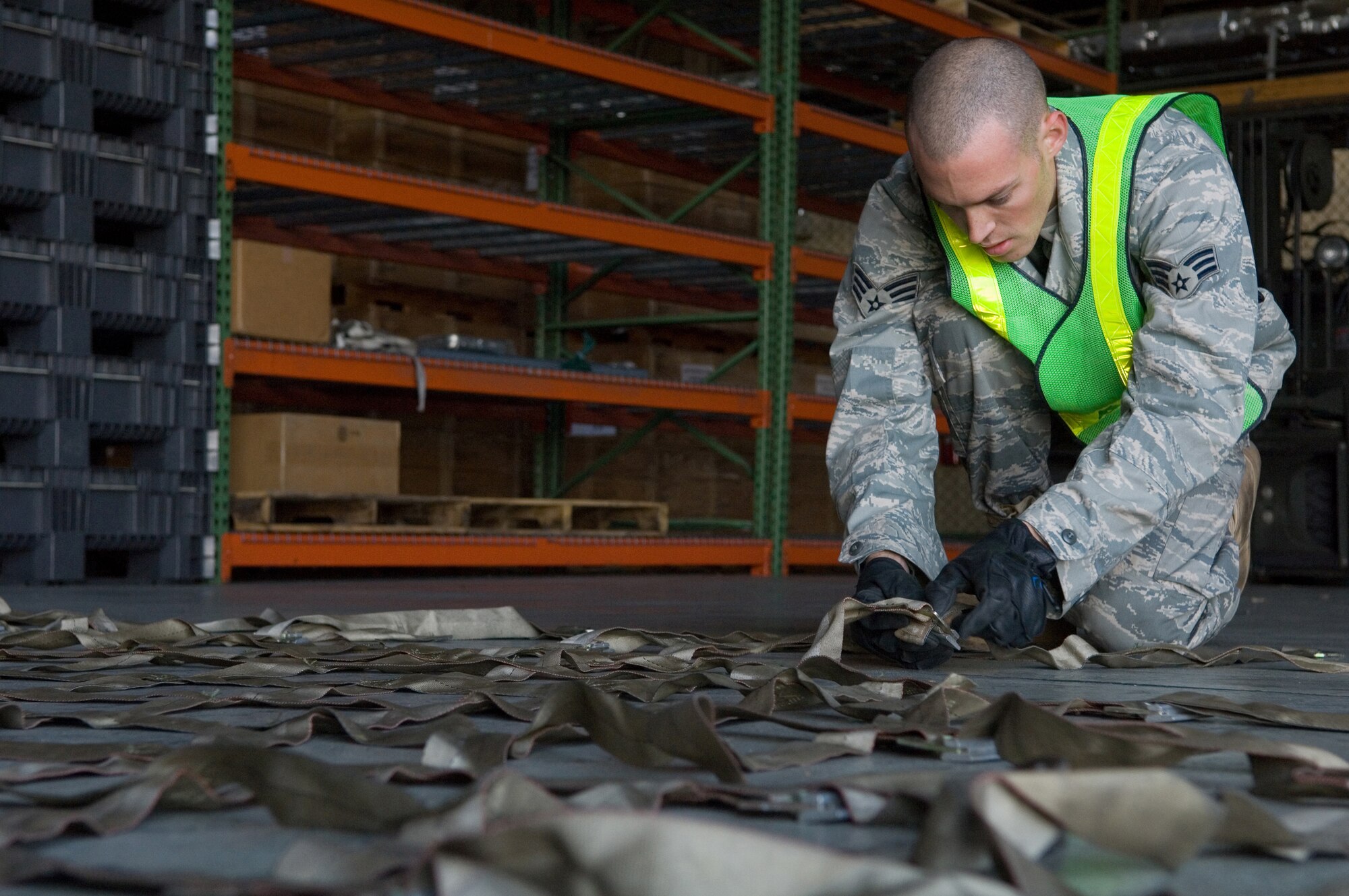 YOKOTA AIR BASE, Japan- Senior Airman Richard Mast, 374th Logistics Readiness Squadron, prepares for a pallet build-up during the Samurai Readiness cargo loading training here, Dec.19. Samurai Readiness Training Day is held monthly to ensure 374th Airlift Wing Airmen are prepared to handle any contingency. (U.S. Air Force Photo by Osakabe Yasuo)