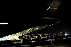 Airmen unload cargo from the back of a C-17 Globemaster III Nov. 19 at an air base in Southwest Asia. The C-17 has been delivering cargo to and from different bases in the area of responsibility in support of Operation Iraqi Freedom. (U.S. Air Force photo/Staff Sgt. Darnell T. Cannady) 
