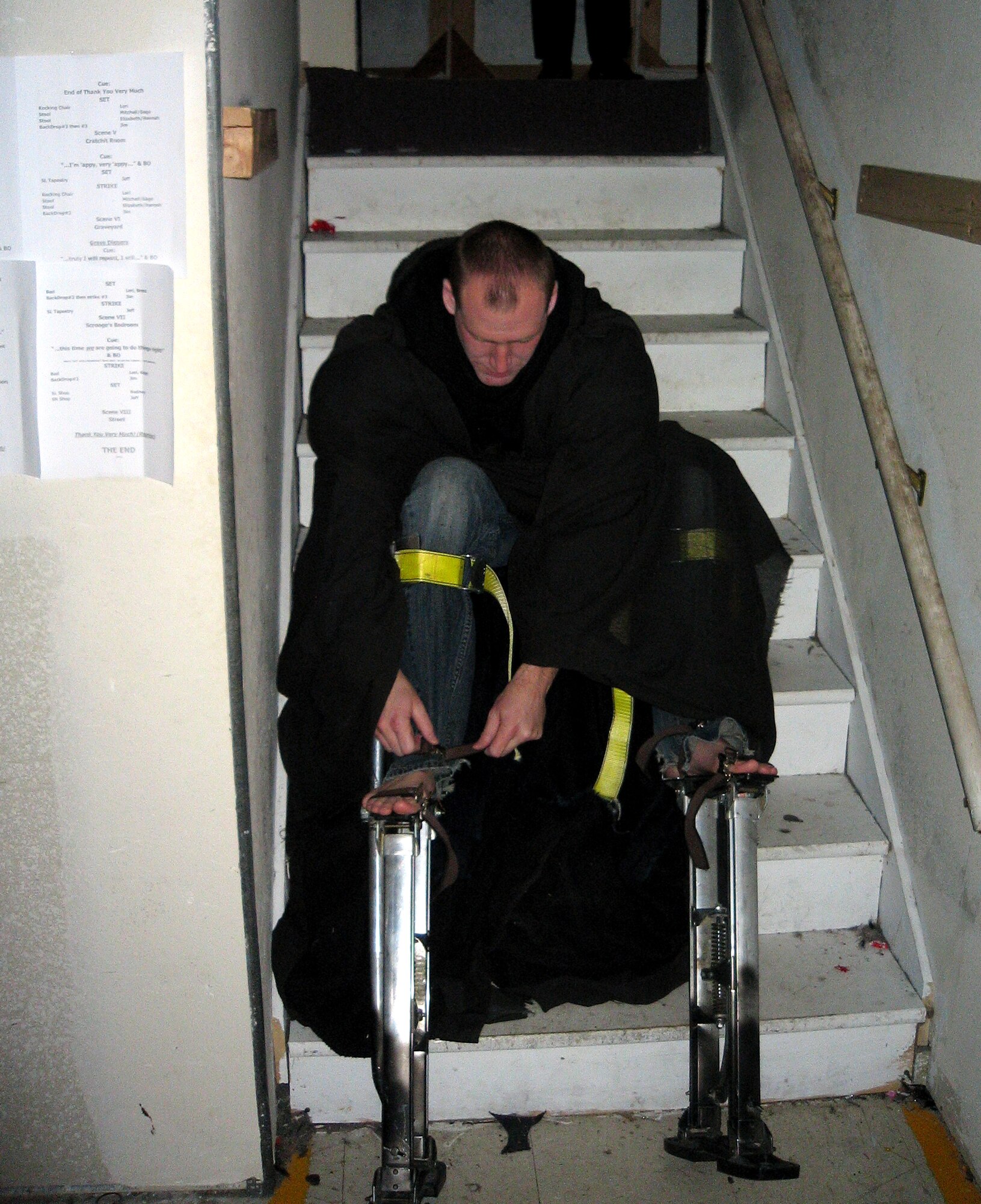 Senior Airman Scott Hansen, 419th Medical Squadron, prepares for his role as Christmas Future in "Scrooge: A Christmas Carol" at the Terrace Plaza Playhouse in Ogden. Airman Hansen wears stilts, makeup, and a large black robe to pull off the role -- all without speaking. (Courtesy photo) 