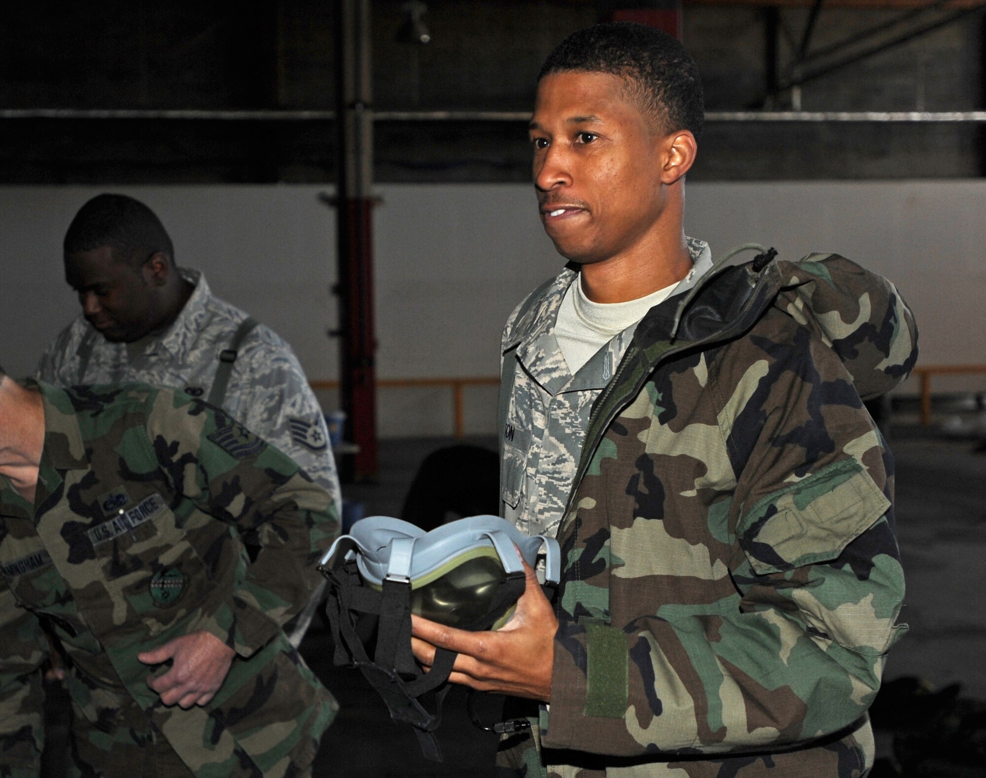 Staff Sgt. Mars Hinton takes off his protective equipment after finishing Chemical, Biological, Radiological, Nuclear and Exlplosives training during the 931st Air Refueling Group's unit training assembly in November. Sergeant Hinton is a supply technician assigned to the 931st Civil Engineer Squadron. The 931st ARG is an Air Force Reserve unit at McConnell Air Force Base, Kan. (U.S. Air Force photo/Tech. Sgt. Jason Schaap)