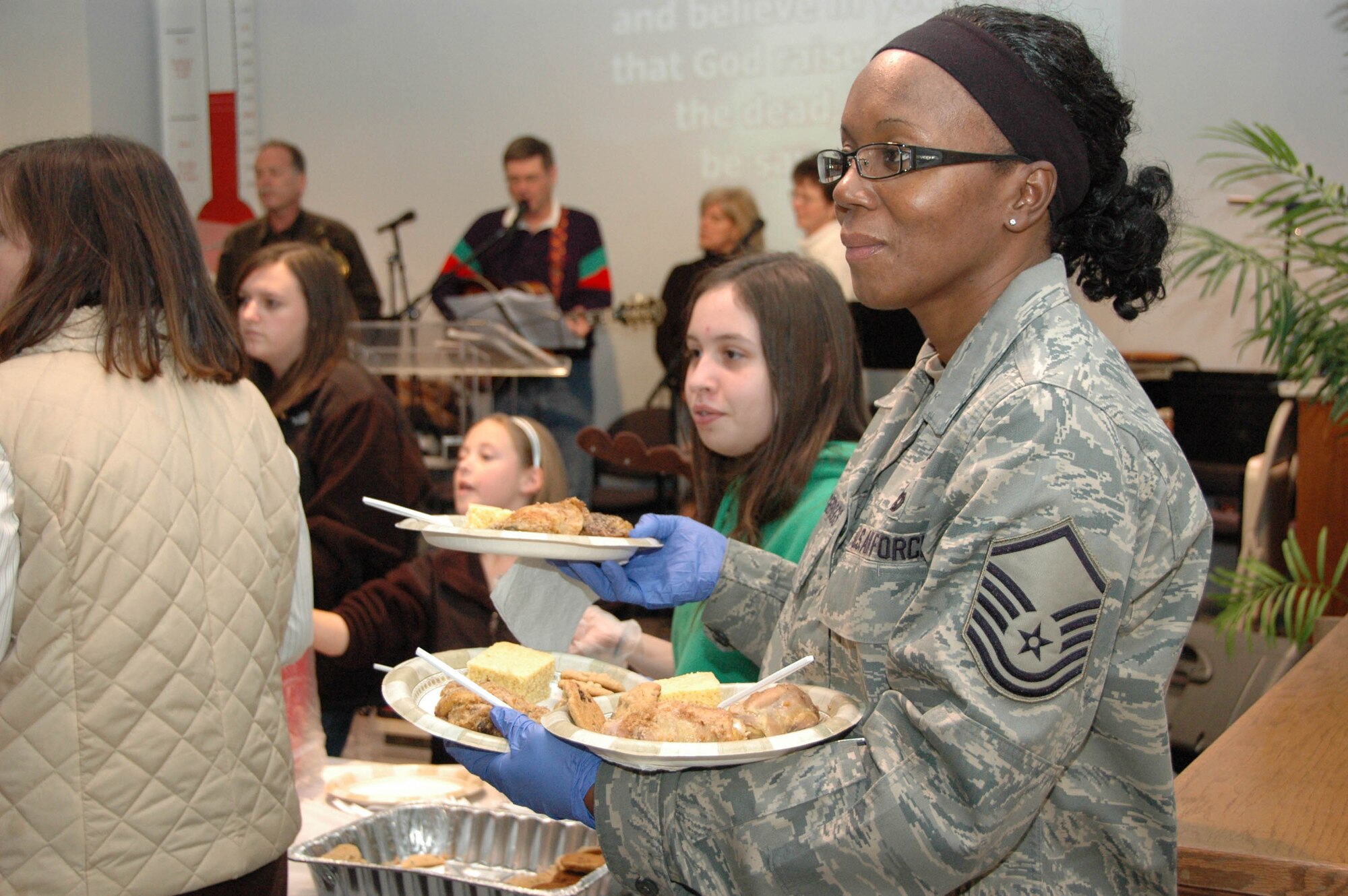MCGUIRE AIR FORCE BASE, N.J. -- Master Sgt. Sebrena Flagg-Briggs along with eight other Reserve volunteers recently helped serve dinner to nearly 250 homeless men and women at the Chosen 300 Ministries facility located in Philadephia, Pa.  In addition to assisting with dinner the volunteers recently collected and delivered more than 85 coats to the mission as part of the 514th Air Mobility Wing's Human Resource Development Council Community Outreach effort.