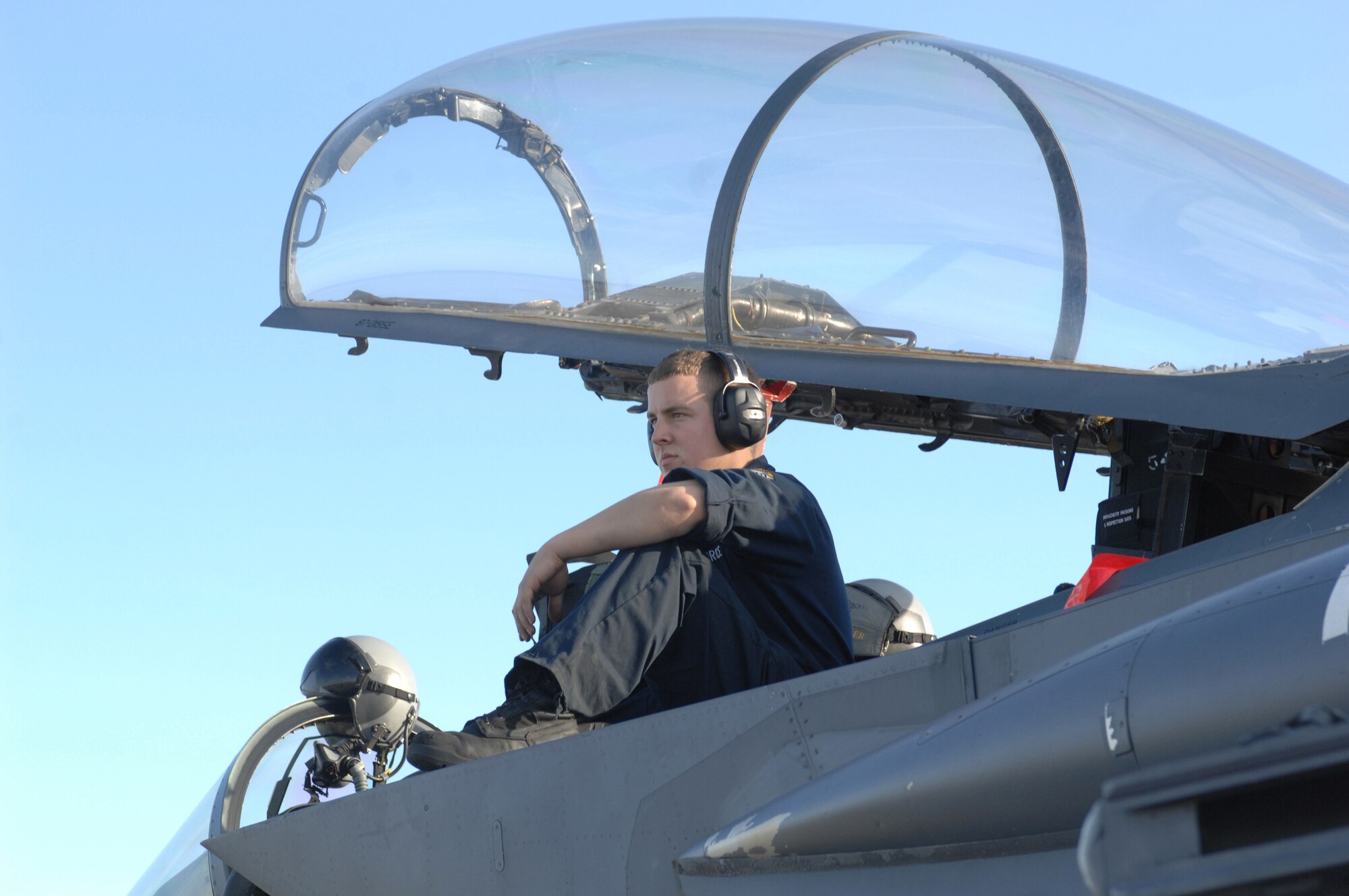 Senior Airman Ryan Evans, a 336th Aircraft Maintenance Unit crew chief, awaits aircrew for the F-15E Strike Eagle he prepared for a training sortie at Tyndall Air Force Base, Fla., Dec. 18. The 336th Fighter Squadron and associated maintenance personnel completed the two week air-to-air combat evaluation called Combat Archer Dec. 19. (U.S. Air Force photo by Staff Sgt. Shawn J. Jones)