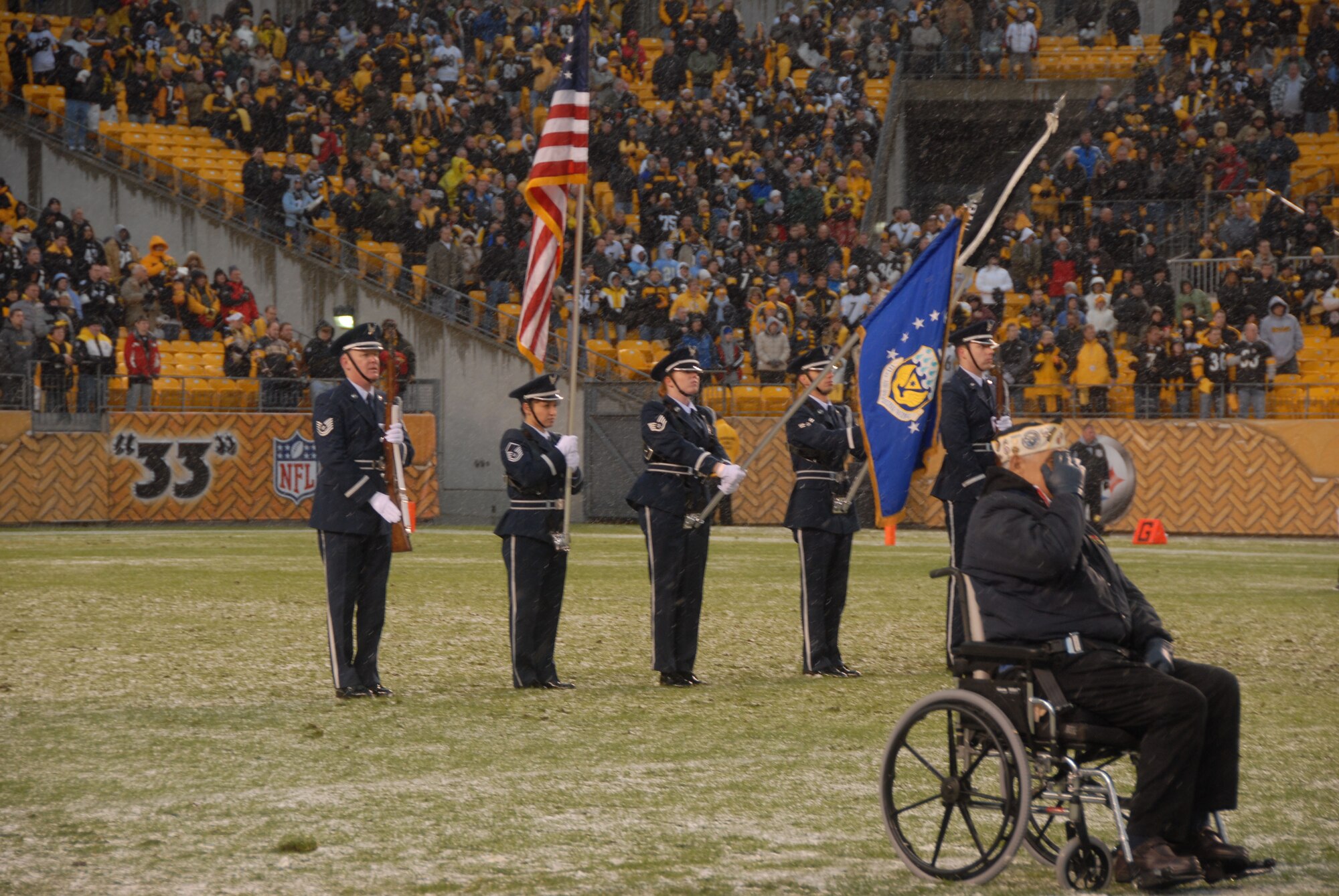 HEINZ FIELD STADIUM, PITTSBURGH, PA - Country recording artist Laura Bryna paid tribute to the military with her hit single "Hometown Heroes" followed by the National Anthem and a 171st Air Refueling Wing KC-135 Stratotanker flyby on Nov. 16 just before the start of a Steelers game. Joining Bryna, the voice of a new, multifaceted advertising campaign for the Air National Guard, were members of the 171 ARW's Honor Guard and a local veteran who had served in each U.S. war. (Air Force photo / Staff Sgt. Shawn Monk)