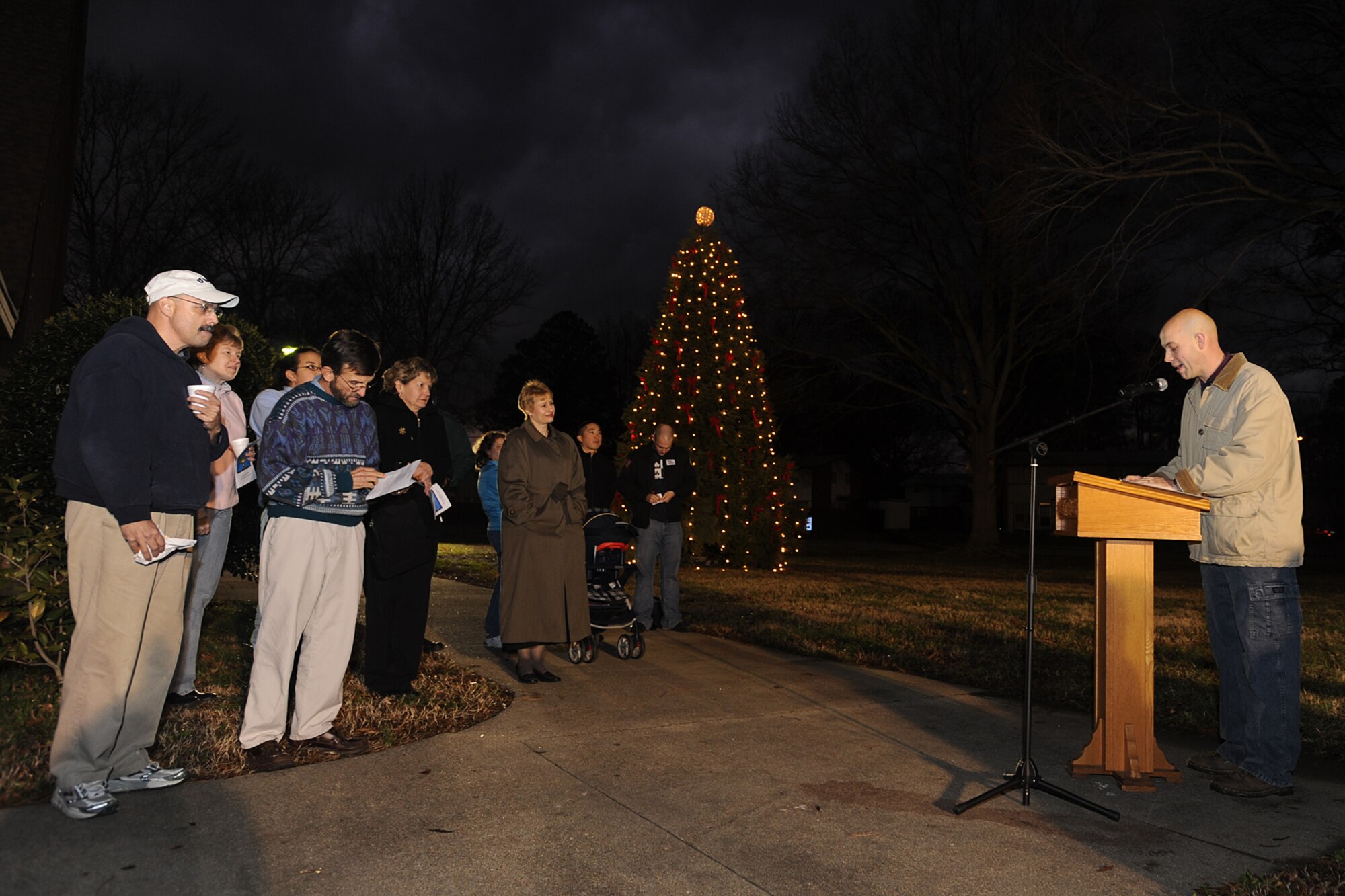 LANGLEY AIR FORCE BASE, Va.- Chaplin (Capt.) Clifford Jones speaks to a crowd during the annual Menorah lighting ceremony Dec 21. The Menorah is a symbol of the Hanukkah miracle in which a day's worth of oil burned for eight days and nights. During the celebration of Hanukkah, one candle is lit on each of the eight nights. (U.S. Air Force photo/Airman 1st Class Gul Crockett)