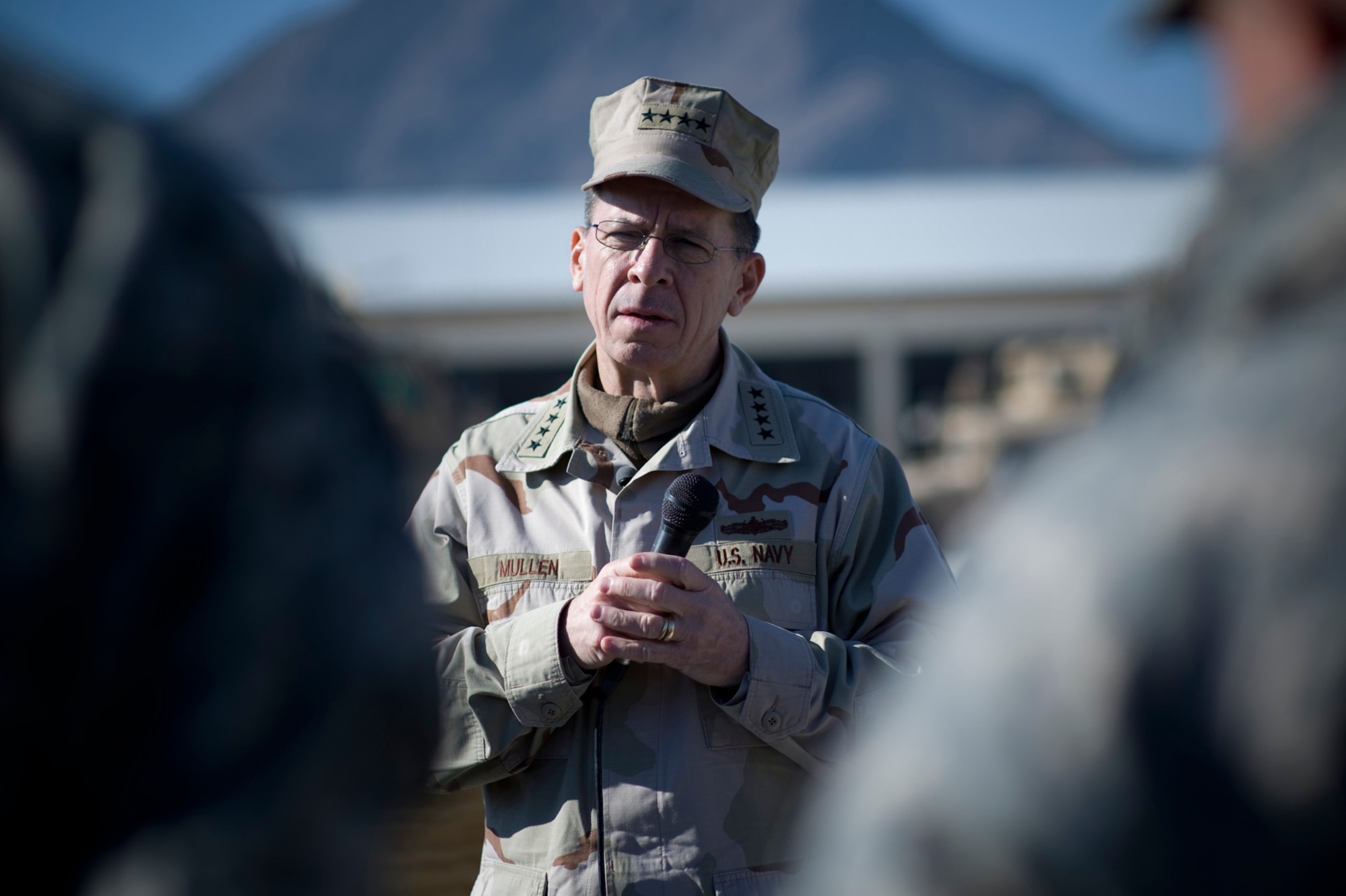 Adm. Mike Mullen, chairman of the Joint Chiefs of Staff listens to a question during an all hands call Dec. 21 with forward deployed servicemembers assigned to Provincial Reconstruction Team Farah Province in Afghanistan.  In this holiday season, Admiral Mullen sends good wishes to all servicemembers and their families.  (Defense Department photo/Petty Officer Chad J. McNeeley)