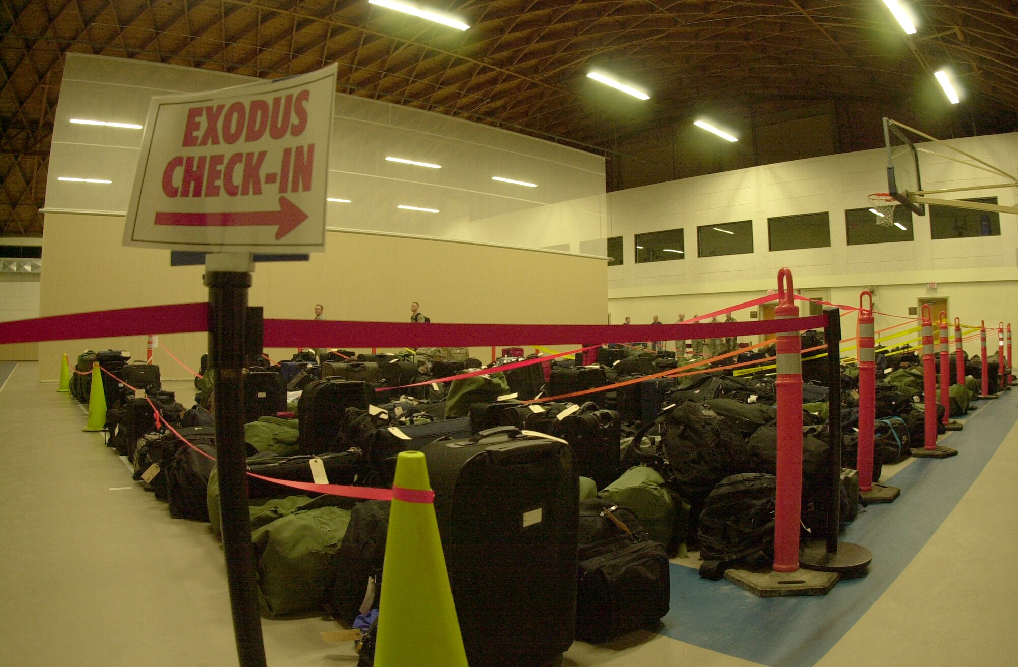 Luggage covers the basketball court of the Carswell Field House the evening of  Dec. 19, 2008 at Goodfellow Air Force Base, Texas. The travel bags belonged to the more than 900 student servicemembers from Goodfellow who began their journeys home via bus travel to surrounding-area airports as part of the base’s Holiday Exodus program. The Holiday Exodus program allows Goodfellow students to enjoy a two-week break from technical training during the winter holiday season. (U.S. Air Force photo by Senior Airman Luis Loza Gutierrez)