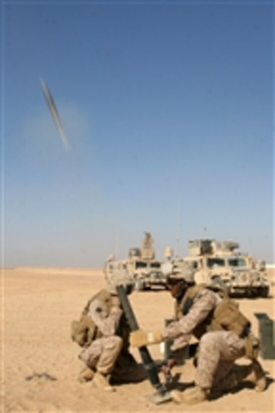U.S. Marine Corps Lance Cpl. Warren Burton, a combat correspondent, fires a 60-mm mortar system during live-fire training outside of Camp Bastion, Afghanistan, on Dec. 12, 2008. Burton is with the command element for the Special Purpose Marine Air Ground Task Force ñ Afghanistan, deployed in support of the NATO-led International Security Assistance Force mission in Afghanistan.  