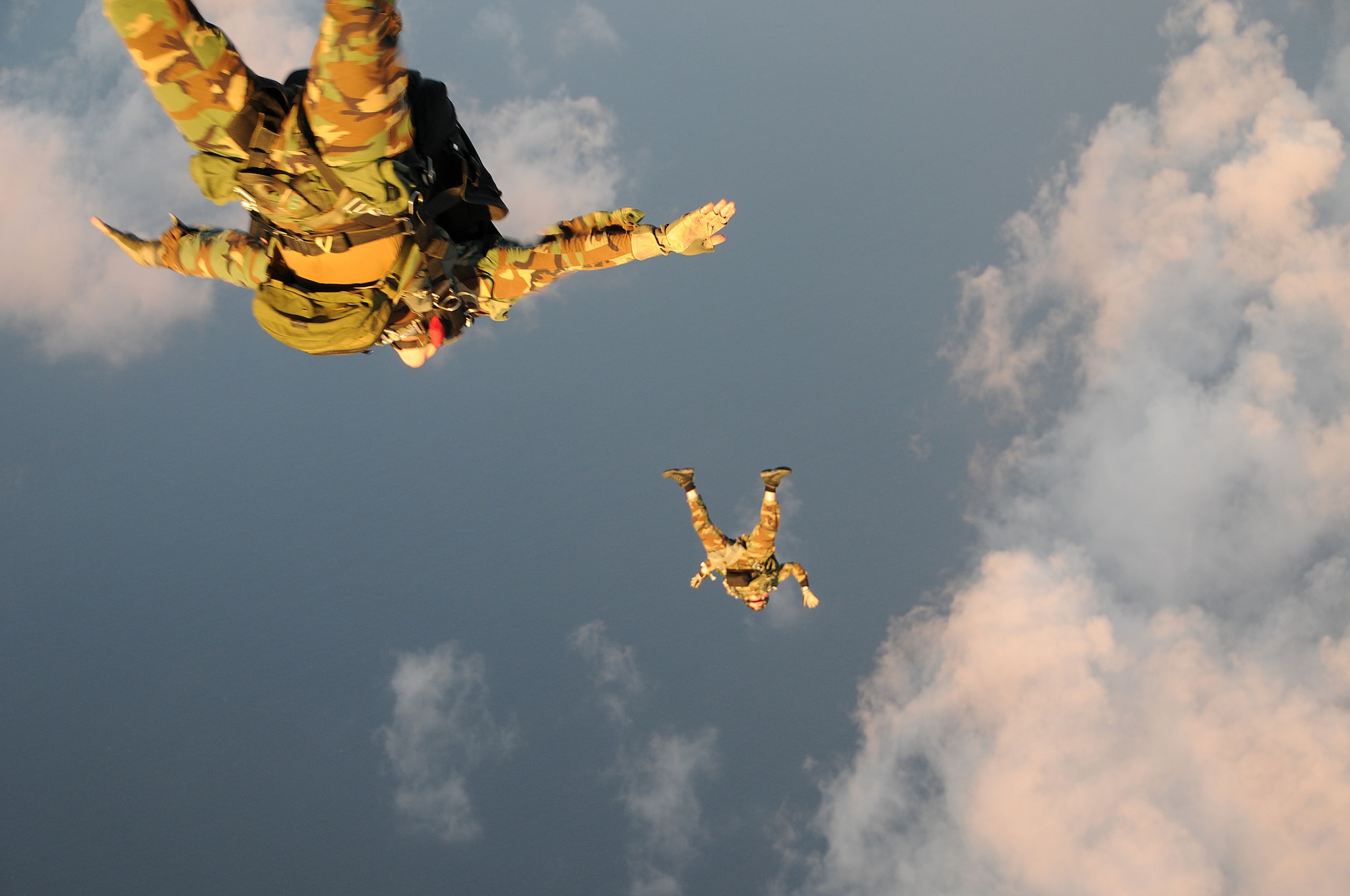 Pararescue specialists assigned to the 31st Rescue Squadron at Kadena Air Base, Japan conduct a freefall jump out of an MC-130P at 10,000 feet over Ie Shima during a training mission Dec. 16, 2008. The 17th Special Operations Squadron flew 21 pararescuemen for a series of static line and freefall jumps and refueled two HH-60s from the 33rd Rescue Squadron during the flight. (U.S. Air Force photo/Staff Sgt Chrissy Best)