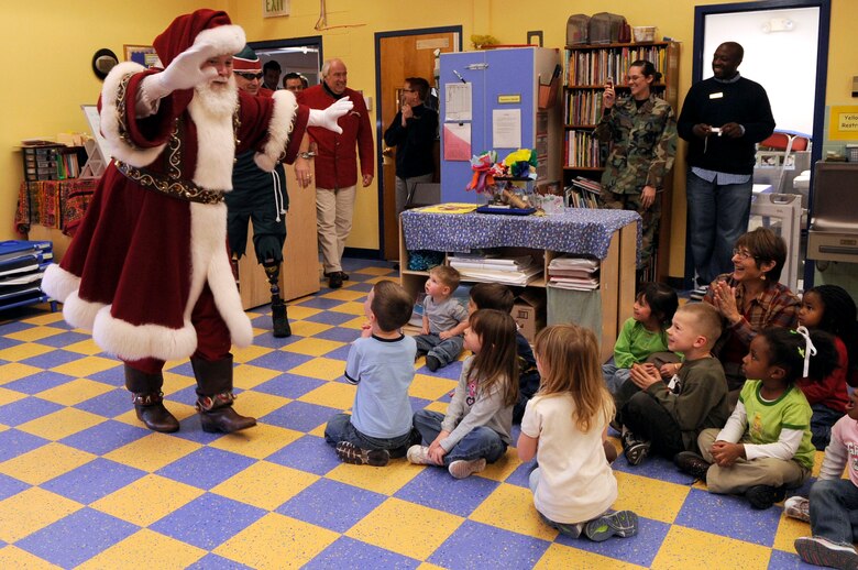 Santa Claus and Elf Dee make a surprise visit to a child development center Dec. 23 at Peterson Air Force Base, Colo. (U.S. Air Force photo/Staff Sgt. Desiree N. Palacios)

