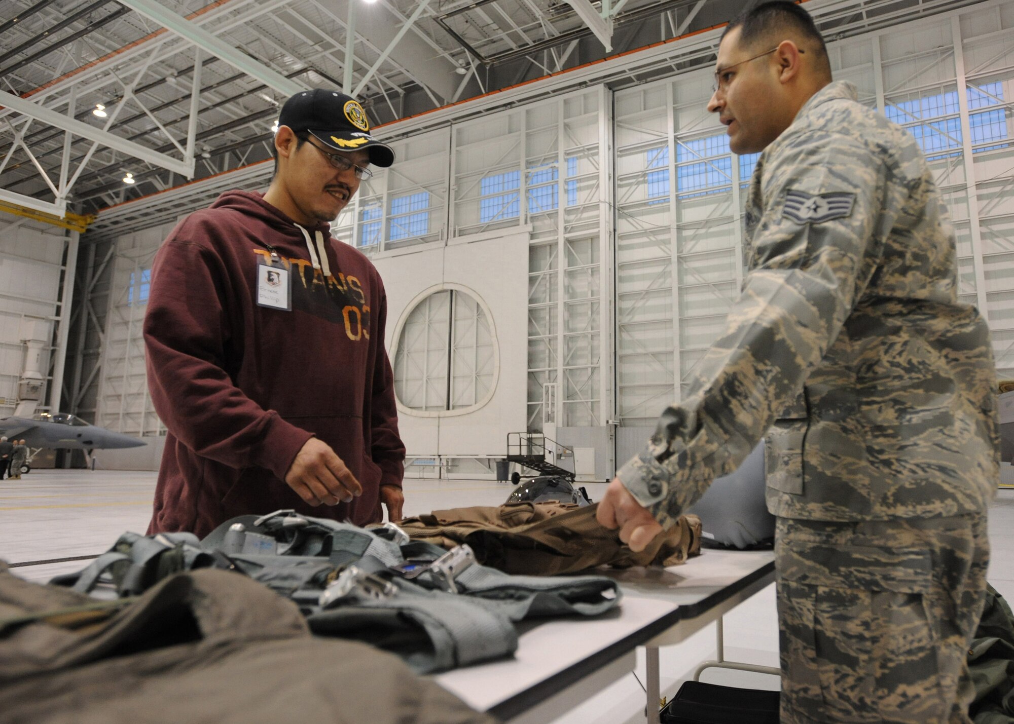 ELMENDORF AIR FORCE BASE, Alaska - An Alaskan Tribal leader learns about the  JHAMIC helmet used by F-22 pilots from Staff Sgt. Ramiro Castillo Dec. 9, 2008. Tribal leaders attended a tour for the fifth annual Tribal and Military Leaders Meeting. (U.S. Air Force photo/Senior Airman Matthew Owens)