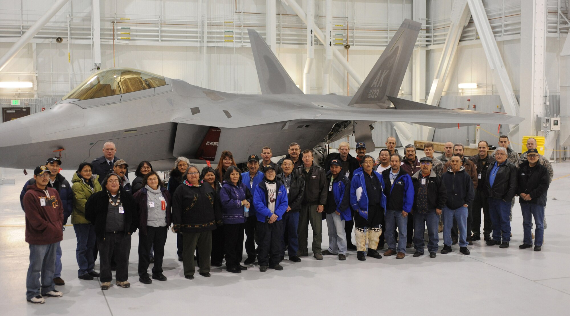 ELMENDORF AIR FORCE BASE, Alaska - Tribal Leaders pose for a photo with an F-22 Raptor and 11th Air Force Alaskan Command host Lt. Gen. Dana T. Atkins Dec. 9, 2008. Tribal leaders attended a tour for the fifth annual Tribal and Military Leaders Meeting. (U.S. Air Force photo/Senior Airman Matthew Owens)