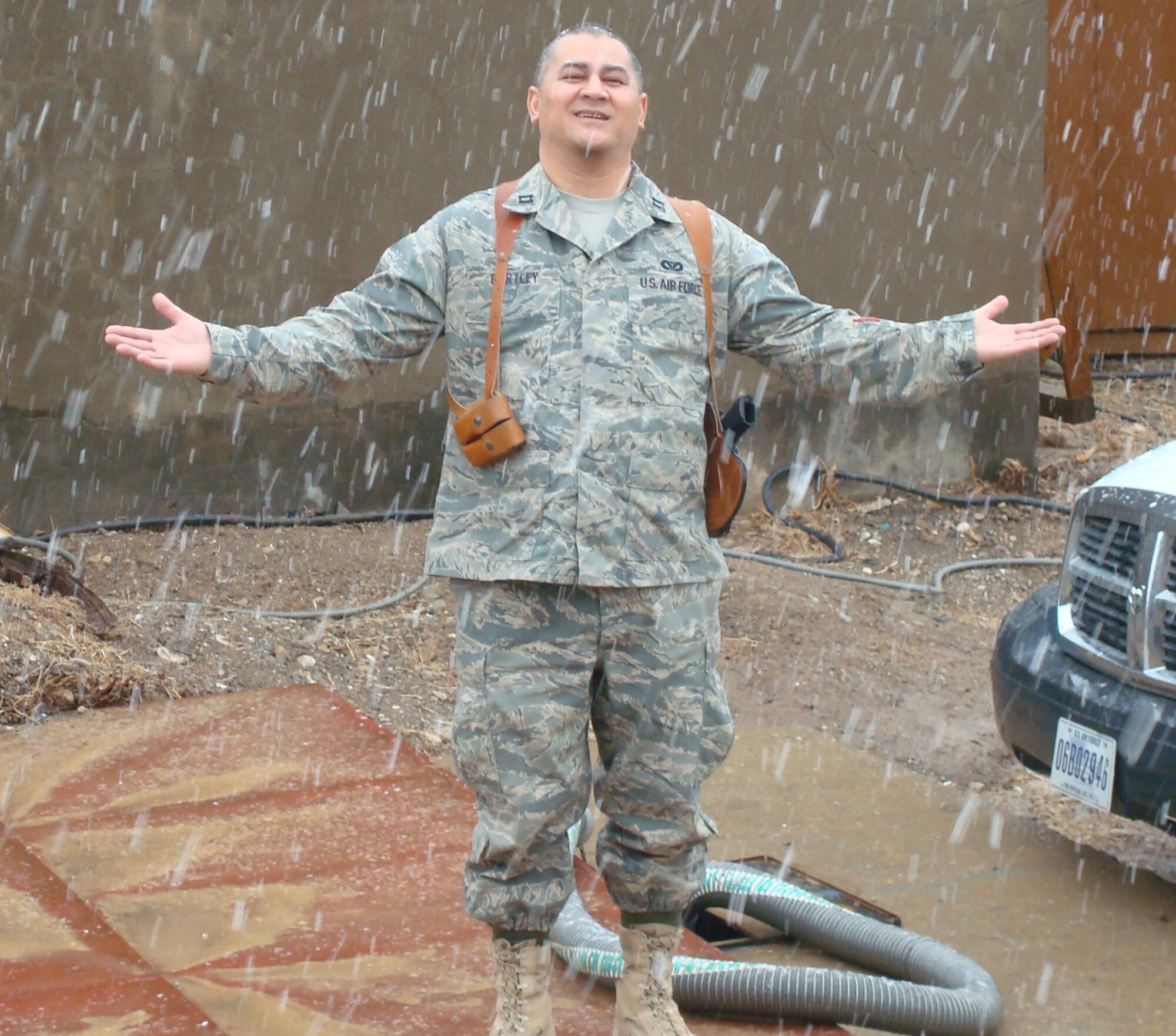 Air Force Reservist Capt. Rudolph Bartley enjoys some falling snow at Kirkuk Regional Air Base Iraq January 2008. Capt. Bartley was selected as the 940th Air Refueling Wing's 2008 Company Grade Officer of the Year. (Courtesy Photo)                          