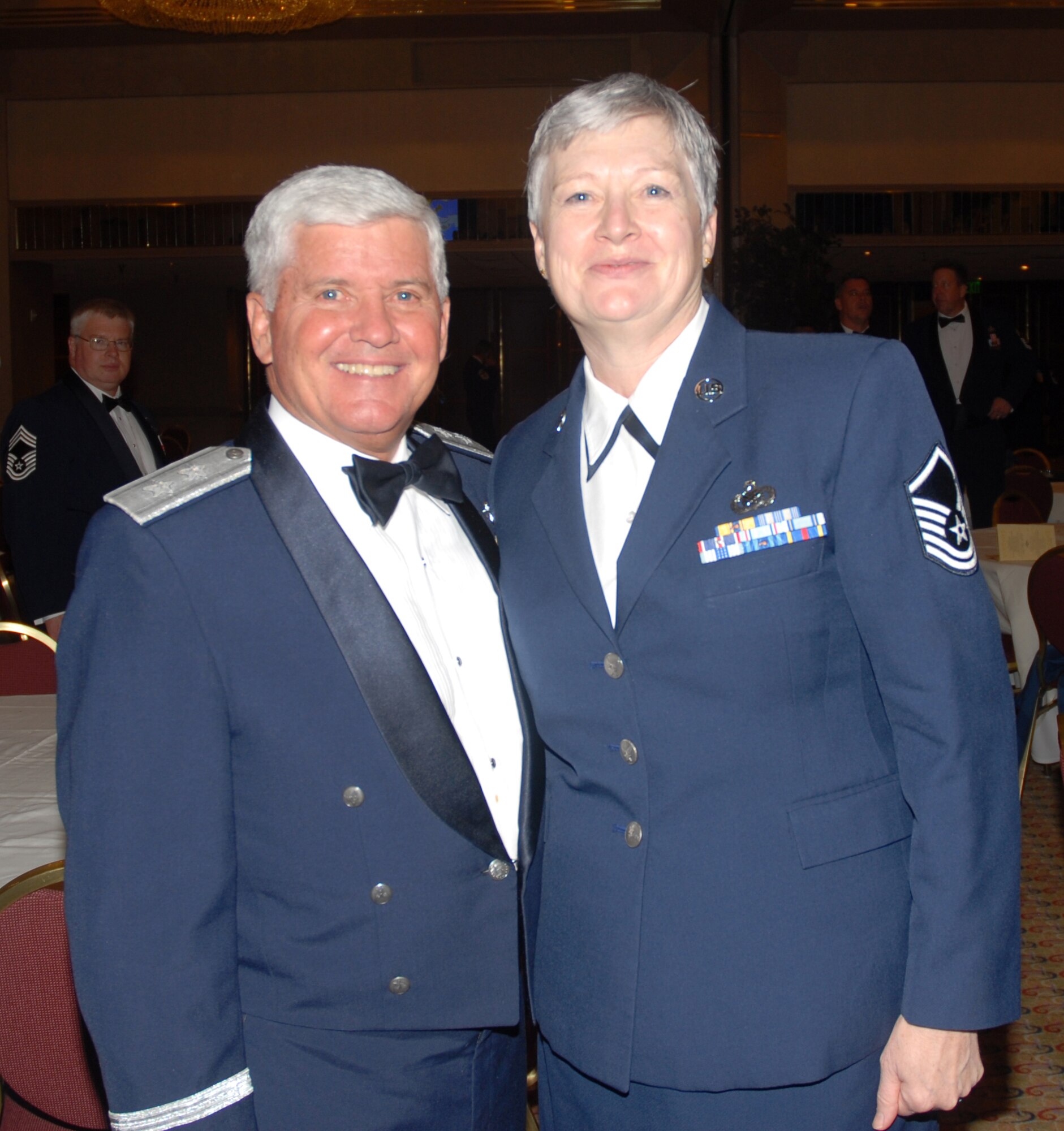 Air Force Reservist Master Sgt. Ellen Hatfield poses for a photograph with Maj. Gen. Allan R. Poulin, vice commander, Air Force Reserve Command, at the 2007 12 Outstanding Airmen of the Year banquet at the Atlanta Hilton, March 6, 2008. Master Sgt. Hatfield was selected as the 940th Air Refueling Wing's 2008 Senior Non-Commissioned Officer of the Year. (Courtesy Photo)