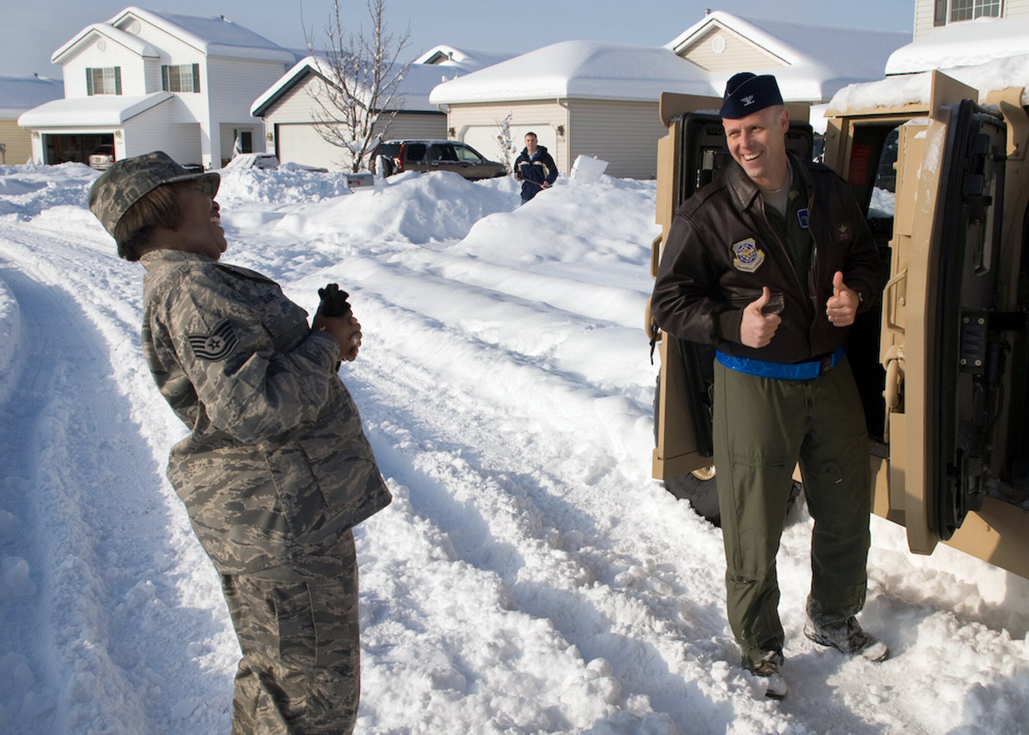 AIRWAY HEIGHTS, Wash. – Col. Blaine Holt, 92nd Air Refueling Wing vice commander, shines two thumbs up as he prepares to depart after the re-enlistment ceremony for Tech. Sgt. Michele Glaspie, 92nd Aeromedical Dental Squadron, Dec. 19. The Colonel was joined by a small group, including the 92nd Air Refueling Wing command chief, Chief Master Sgt. David Nordel, and Lt. Col. Paul Nelson, the 92nd AMDS commander. (U.S. Air Force photo / Staff Sgt. Mikel Daniel)