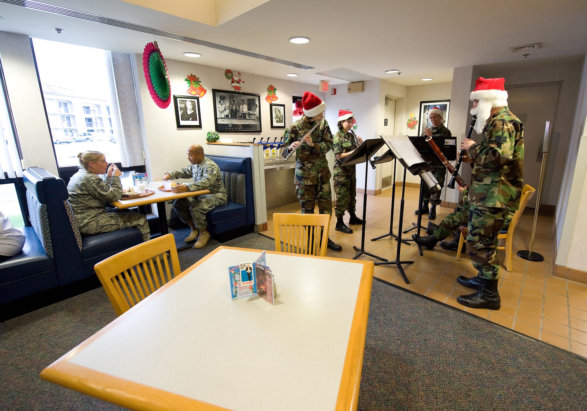 The U.S. Air Force Heritage of America Band 'Langley Winds' performed at the Patterson Dining Hall Dec. 16.  The five-member active duty group has a long history of entertaining the American public and promoting esprit de corps within the military.  Consisting of several unique musical ensembles, the USAF Heritage of America Band performs for more than one million people throughout a six-state region from Pennsylvania to South Carolina each year.  (U.S. Air Force photo/Jason Minto)  