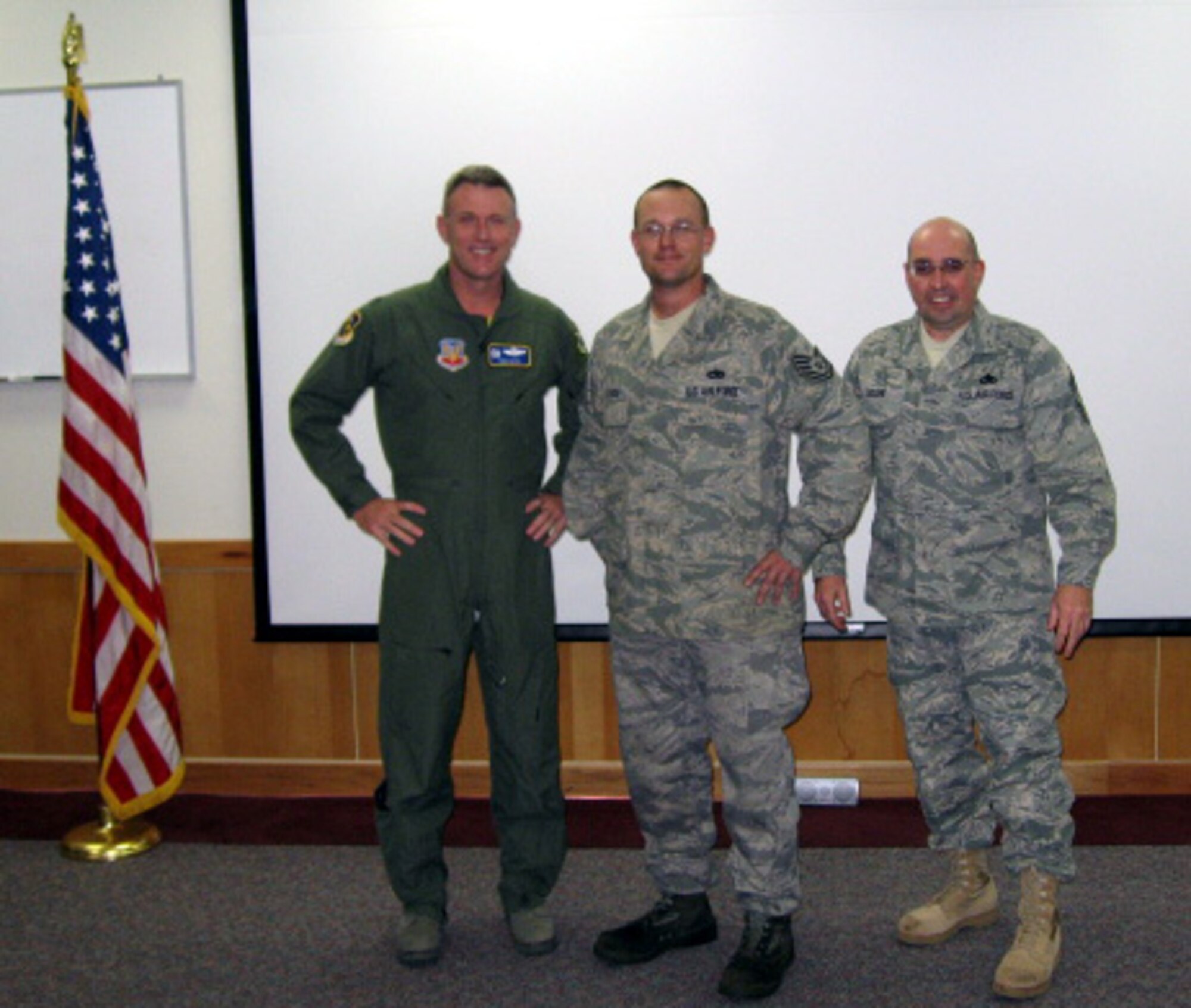 DYESS AIR FORCE BASE, Texas -- Staff. Sgt. Wesley Hilbrich, 7th Aircraft Maintenance Squadron, was promoted to technical sergeant Dec. 19 through the Stripes for Exceptional Performers program. Colonel Robert Gass (left), 7th Bomb Wing commander, and Command Chief Master Sgt. David Goldie (right) presented Sergeant Hilbrich (center) his new stripe. The Air Force Chief of Staff approves a very limited number (lesser of 422 stripes or 2 percent of projected WAPS promotions to grade E-5, E-6 and E-7) of allocations for a STEP promotion, according to the Military Professional Development Center. There are usually only two or three STEP allocations given to each wing per year, which commanders use to promote "exceptional" individuals to staff sergeant, technical sergeant, and master sergeant. (Courtesy photo)
