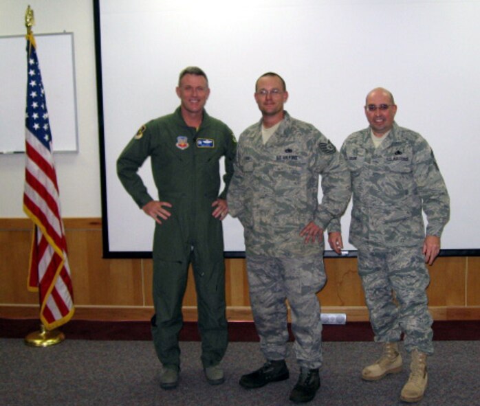 DYESS AIR FORCE BASE, Texas -- Staff. Sgt. Wesley Hilbrich, 7th Aircraft Maintenance Squadron, was promoted to technical sergeant Dec. 19 through the Stripes for Exceptional Performers program. Colonel Robert Gass (left), 7th Bomb Wing commander, and Command Chief Master Sgt. David Goldie (right) presented Sergeant Hilbrich (center) his new stripe. The Air Force Chief of Staff approves a very limited number (lesser of 422 stripes or 2 percent of projected WAPS promotions to grade E-5, E-6 and E-7) of allocations for a STEP promotion, according to the Military Professional Development Center. There are usually only two or three STEP allocations given to each wing per year, which commanders use to promote "exceptional" individuals to staff sergeant, technical sergeant, and master sergeant. (Courtesy photo)
