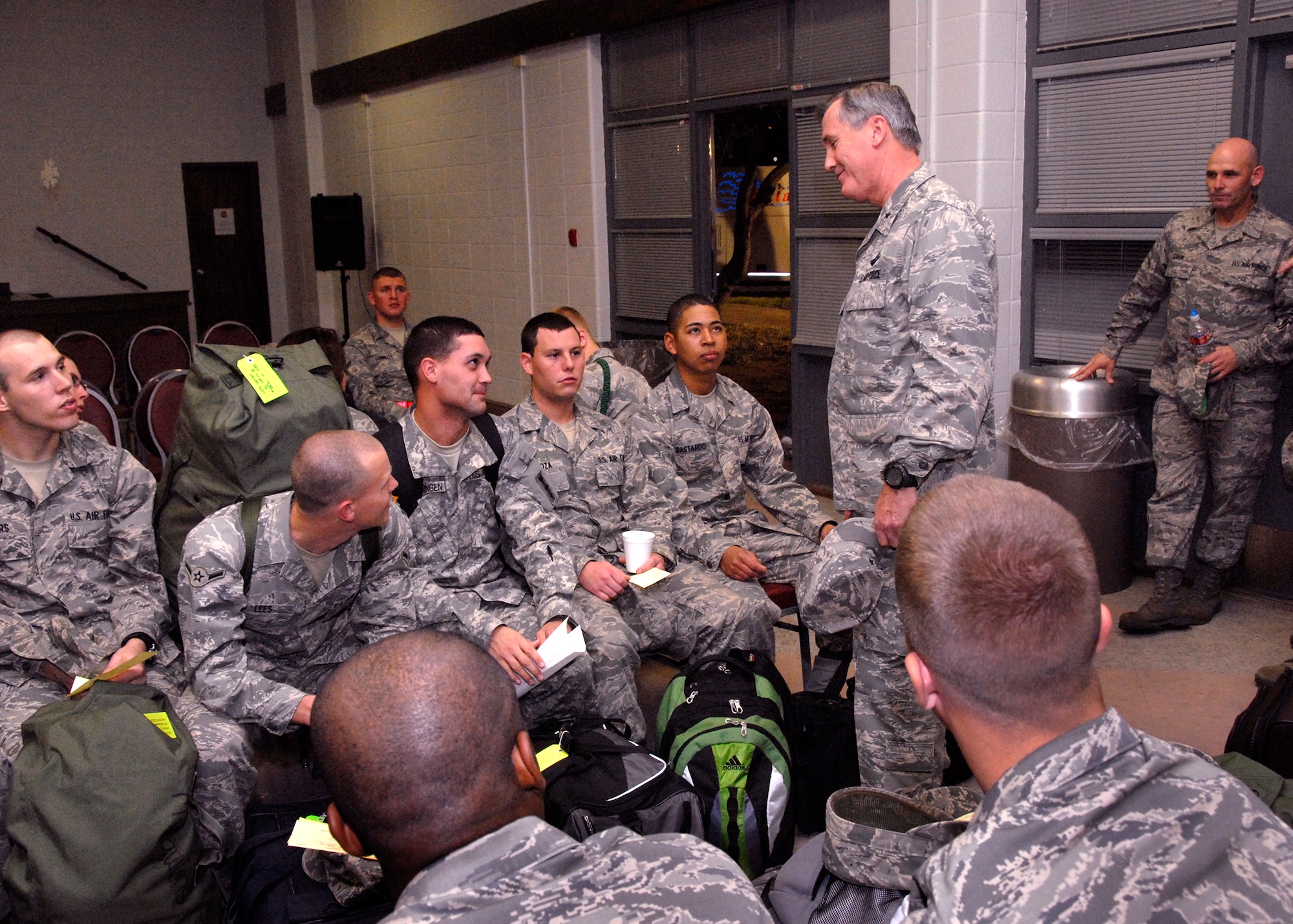 82nd Training Wing Commander Brig. Gen. O.G. Mannon visits with the students as they wait their turn to load the bus to the airport to go home for the holidays early morning Dec. 20. About 4,000 Airmen went home for the holiday exodus and will return in early January to continue training Jan. 5. (U.S. Air Force photo/Harry Tonemah) 