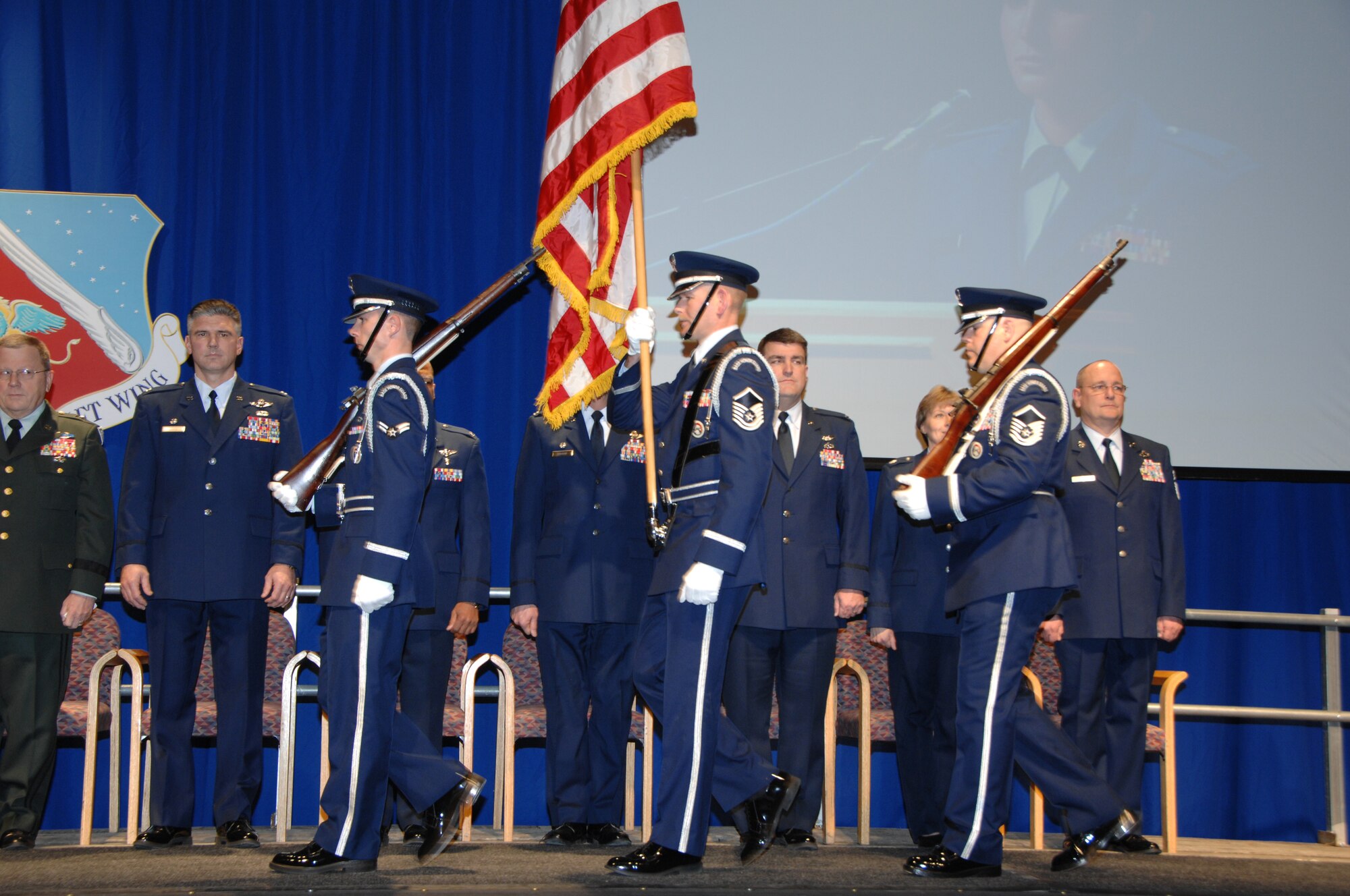 The 133rd Airlift Wing Honor Guard marches to display the colors in a hangar during the 133rd Airlift Wing Recognition Ceremony on Dec. 13, 2008. The Minnesota Air National Guard unit in St. Paul holds a ceremony every year recognizing the accomplishments of the Airmen, their families, and others in the community who make the 133rd AW very successful. (USAF photo by Tech. Sgt. John Wiggins)
