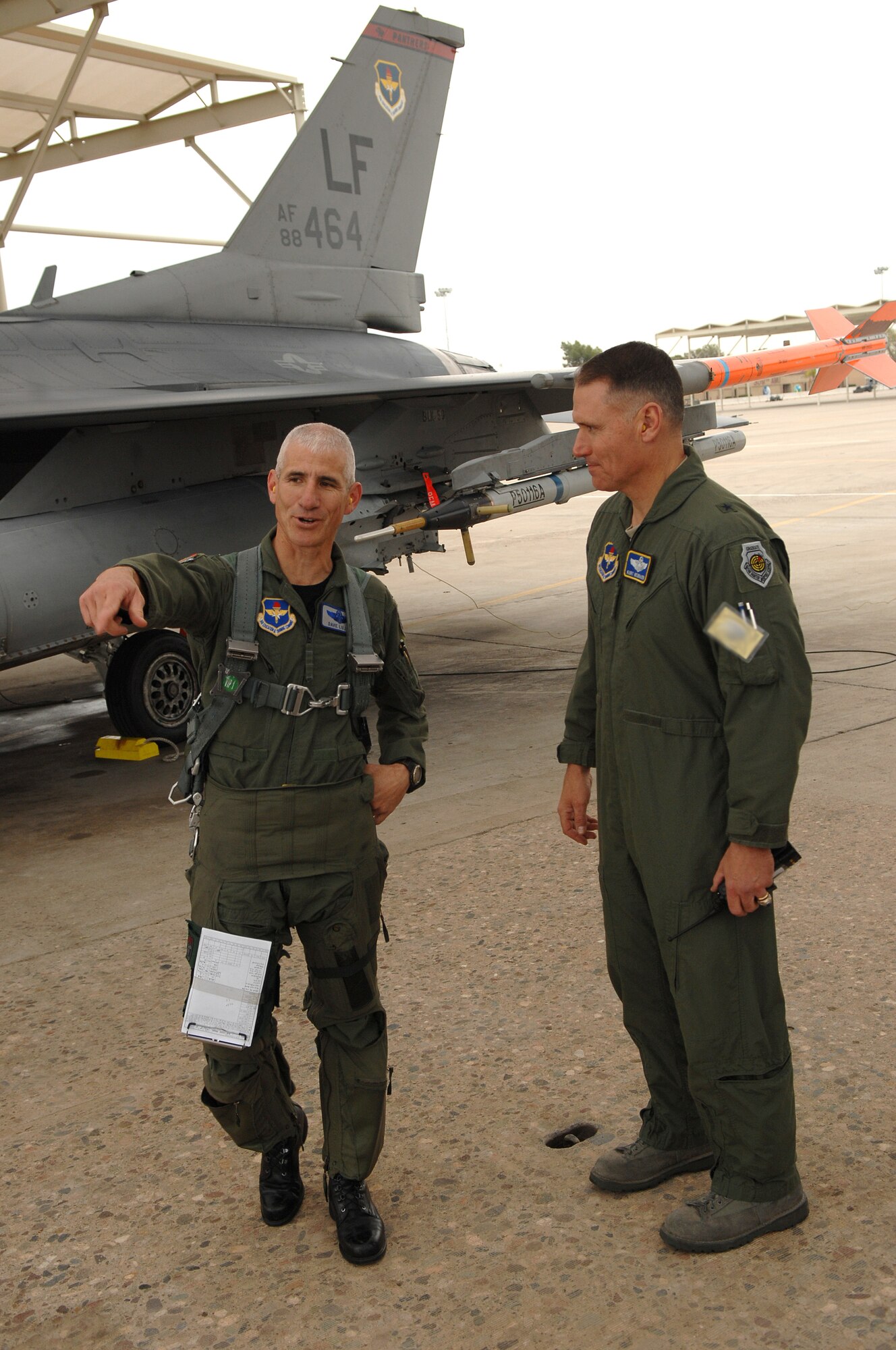 Col. David Lujan (left), 56th Operations Group deputy commander, shares a laugh with Brig. Gen. Kurt Neubauer, 56th Fighter Wing commander, moments after Col. Lujan completed his 4,000th hour in the F-16 Fighting Falcon airframe at Luke AFB, Ariz.  (U.S. Air Force photo/Tech Sgt. Jeffrey A. Wolfe)