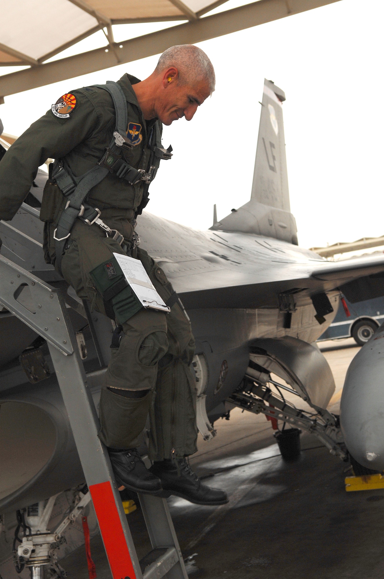 Col. David Lujan, 56th Operations Group deputy commander, climbs out of his F-16 Fighting Falcon moments after completing his 4,000 hour in the airframe at Luke AFB, Ariz.  (U.S. Air Force photo/Tech Sgt. Jeffrey A. Wolfe)