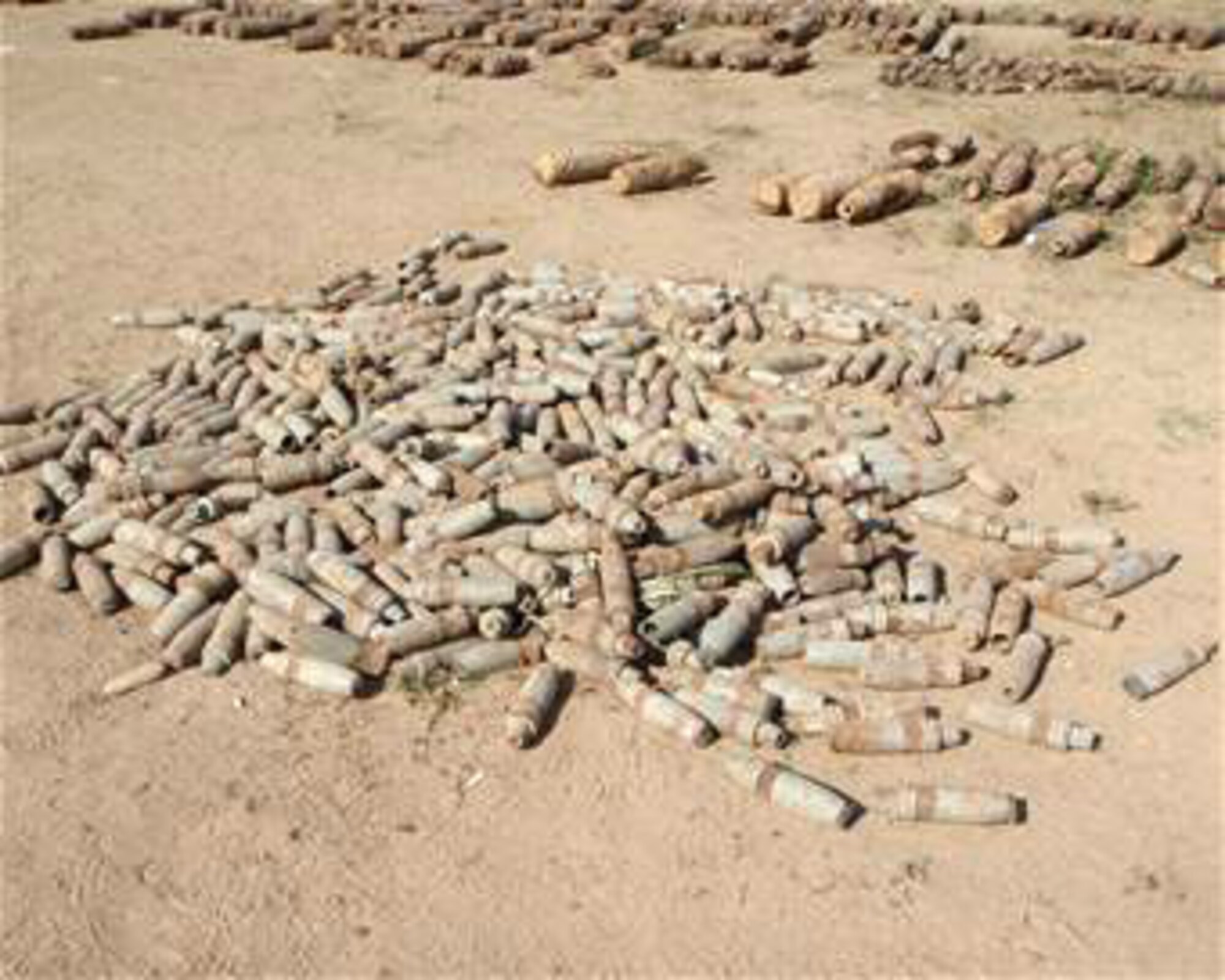 Explosive devices await destruction by explosive ordnance disposal specialists from the 447th Expeditionary Civil Engineer Squadron Explosive Ordnance Disposal Alpha Flight at Sather Air Base, Iraq. The weapons are part of a 13,000-pound cache destroyed by EOD Airmen from Sather AB. (U.S. Air Force photo) 
