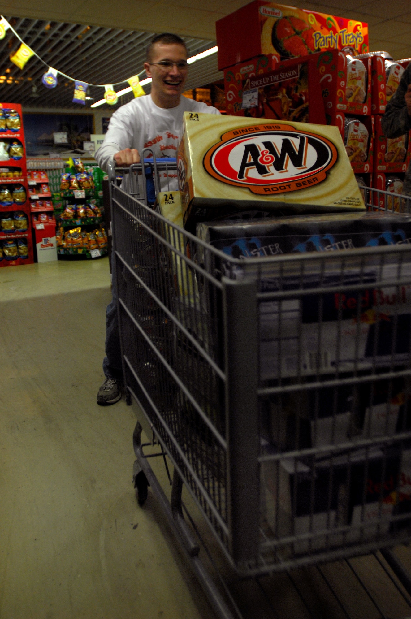 Airman 1st Class Alfred Hayes, 435th Munitions Squadron, races against the clock while collecting as much food and drinks as he can before time is up at the Ramstein Air Base Commissary, Dec. 18, 2008, Ramstein Air Base, Germany. A1C Hayes was participating in the 435th Services Squadron stocking stuffers event racking up over $881.00 of free groceries. (U.S. Air Force photo by Airman 1st Class Kenny Holston)