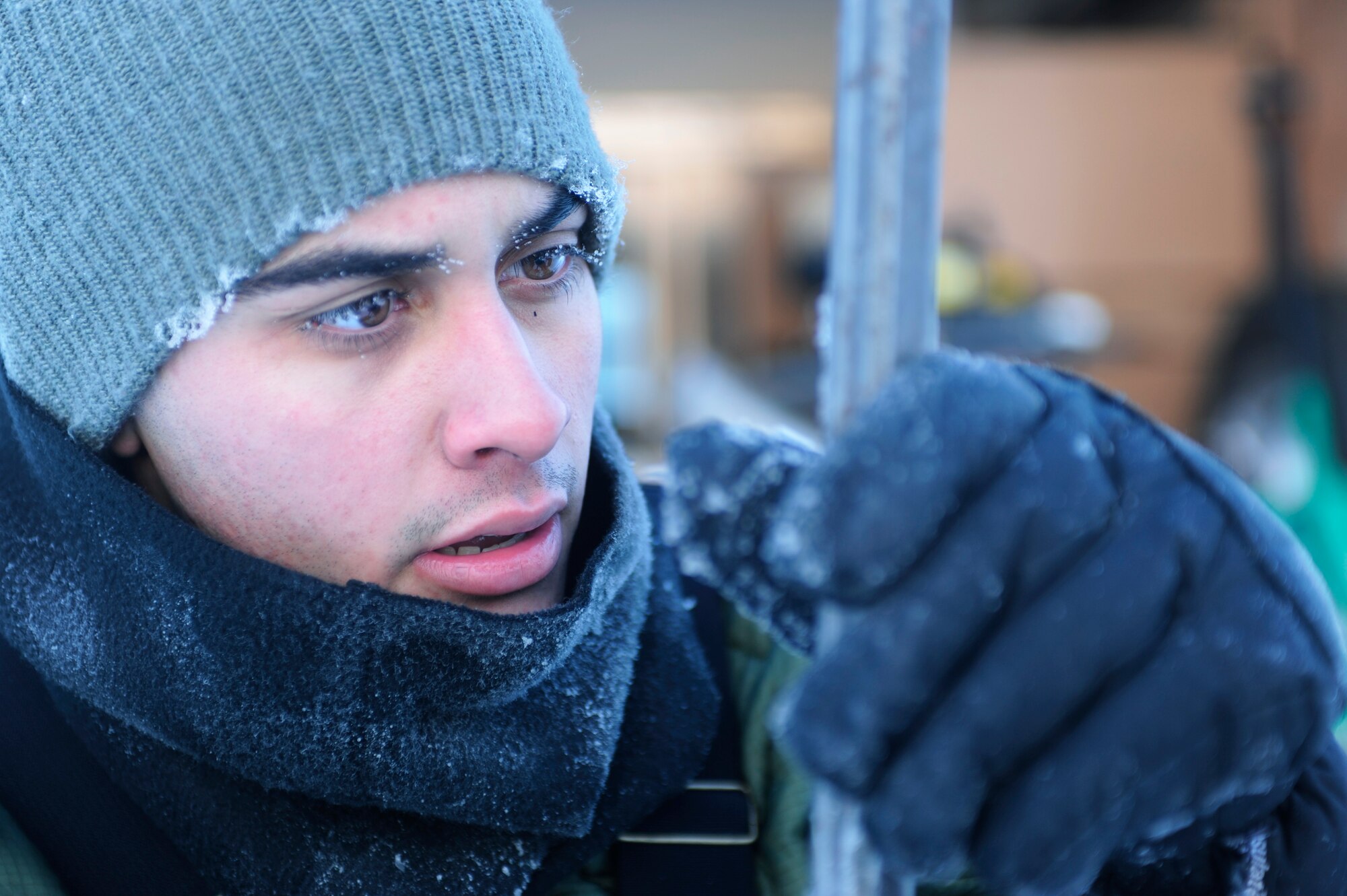 Airman 1st Class Alexandre Leseur confirms his measurement was at least 60 inches of ice before moving on to the next location Dec. 23, 2008, in Fairbanks, Alaska. The ice bridge takes six to 10 weeks to complete in usually sub-zero weather. The ice bridge is actually a series of ice plateaus five-feet deep, 32 miles long and capable of supporting more than 110 tons -- and will melt back into the river as spring thaw hits. Airman Leseur is assigned to the 354th Civil Engineer Squadron range maintenance, Eielson Air Force Base, Alaska.  (U.S. Air Force photo/Senior Airman Jonathan Snyder)