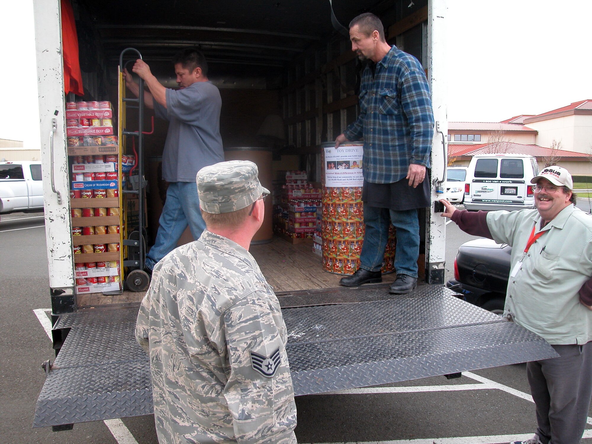 TRAVIS AIR FORCE BASE, Calif. -- Members of the 349th Air Mobility Wing donated more than 4,230 pounds of food to help feed the hungry this past Christmas season as part of the annual Wing Chaplain’s Holiday Food Drive.  
The recipient of this year’s annual Holiday Food Drive donation benefited the Mission Solano Food Bank, Dec 23. (Pictured left to right: Staff Sgt. Michael W. Pierce, 349th Chaplain office, Mr. Jaun H. Tomelloso, Mr. Jerry Monckton and Mr. Terry Irons, Mission Solano Food Bank)
The need for donations continues throughout the year. Individual groups or squadrons who want to organize a unit project should contact the Wing Chaplain’s office at (707) 424-0308, for more information about how best to help. (U.S. Air Force photo/Chaplain (Maj.) Le Bane Hall)