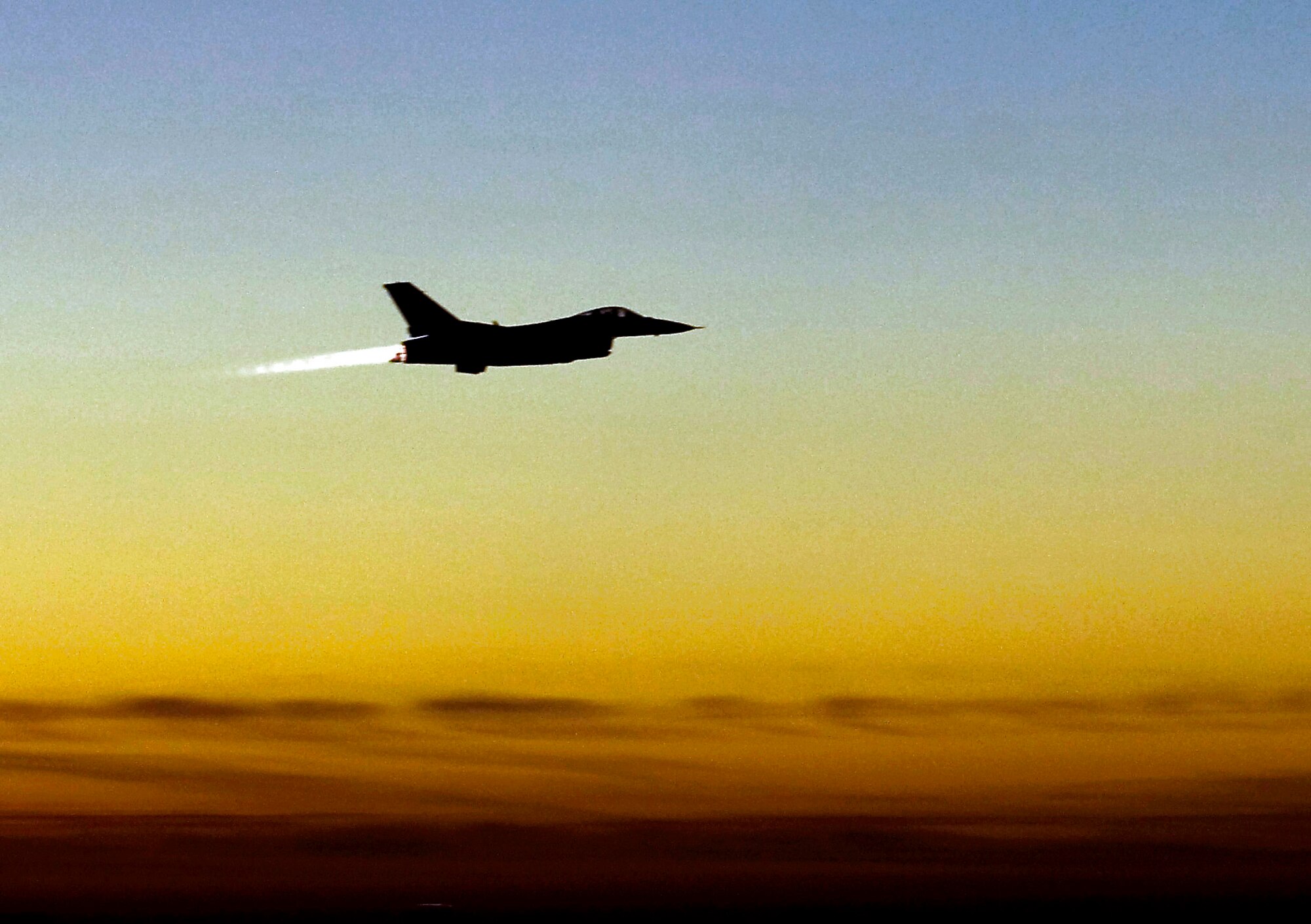 An F-16 Fighting Falcon with the 55th Expeditionary Fighter Squadron takes off on a combat mission just after sunset Dec. 18 from Joint Base Balad, Iraq. The 332nd Air Expeditionary Wing at Balad is the most forward-deployed Air Force wing participating in Operation Iraqi Freedom, and its heritage is tied to the famous 332nd Fighter Group "Tuskegee Airmen" of World War II. The jet is deployed from the 20th Fighter Wing at Shaw Air Force Base, S.C. (U.S. Air Force photo/Tech. Sgt. Erik Gudmundson)