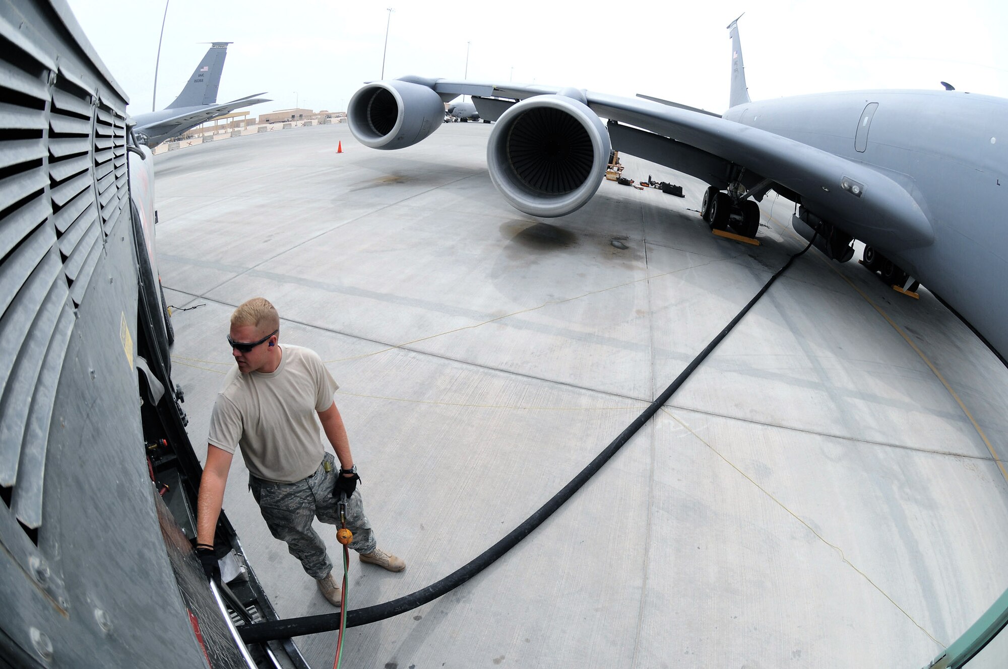 Airman 1st Class Bradley Dean checks over the gauges on his fuel truck while fueling a KC-135 Stratotanker at an air base in Southwest Asia. He keeps his attention on the crew chief of the aircraft and the gauges on his fuel truck. Airman Dean is a fuels apprentice assigned to the 379th Expeditionary Logistics Readiness Squadron. He is a native of Tennessee Colony, Texas, and deployed from Moody Air Force Base, Ga. (U.S. Air Force photo/Tech. Sgt. Michael Boquette)
