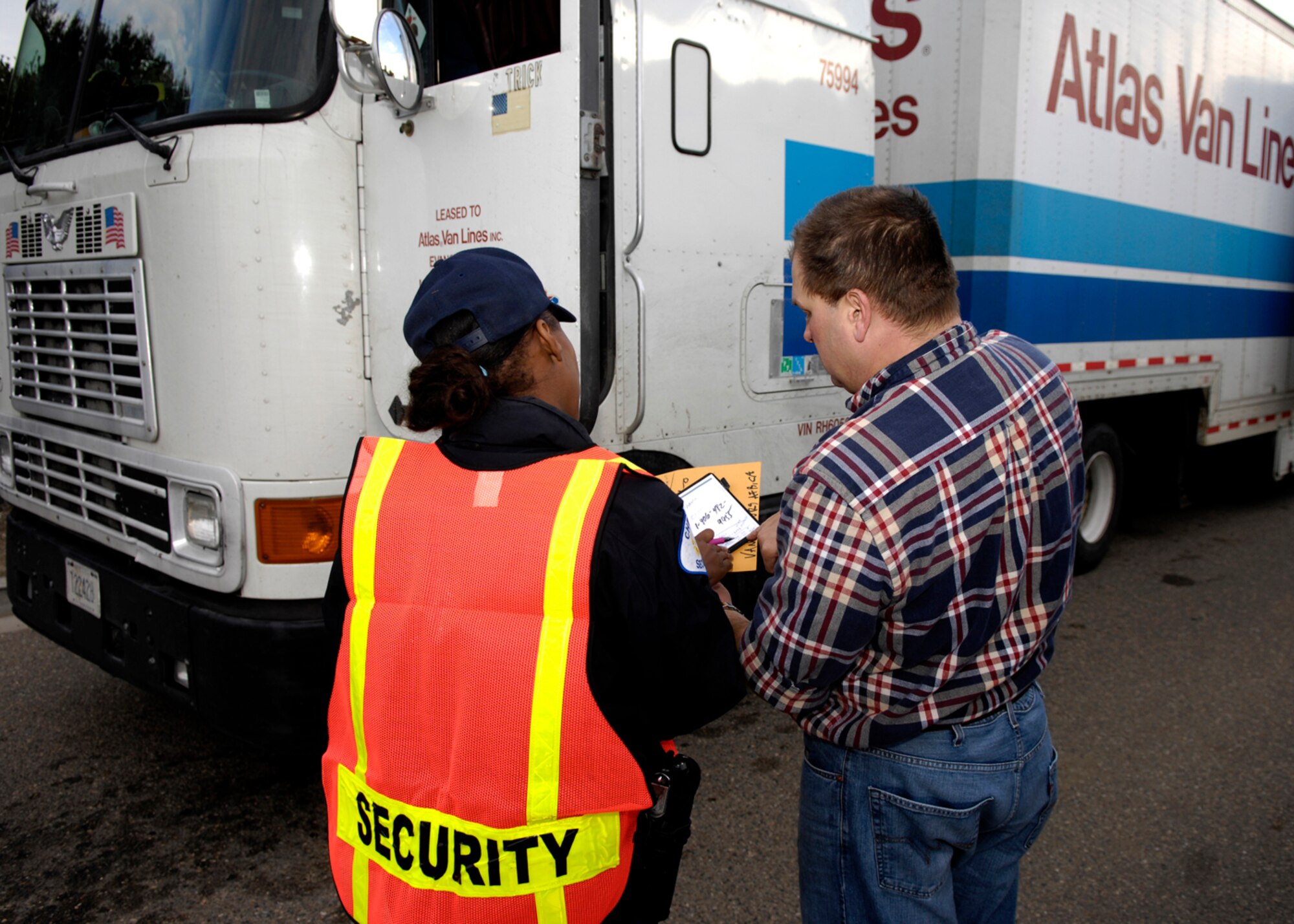 VANDENBERG AIR FORCE BASE, Calif. -- Amanda Andrews, a gate guard with Chenega Integrated Systems, performs a vehicle inspection at the Lompoc Gate on Tuesday. Security forces and 30th Space Wing leadership are asking Team V members to avoid using the Lompoc Gate for non-commercial base access, due to increased commercial traffic at the gate. (U.S. Air Force photo/Airman 1st Class Jonathan Olds) 