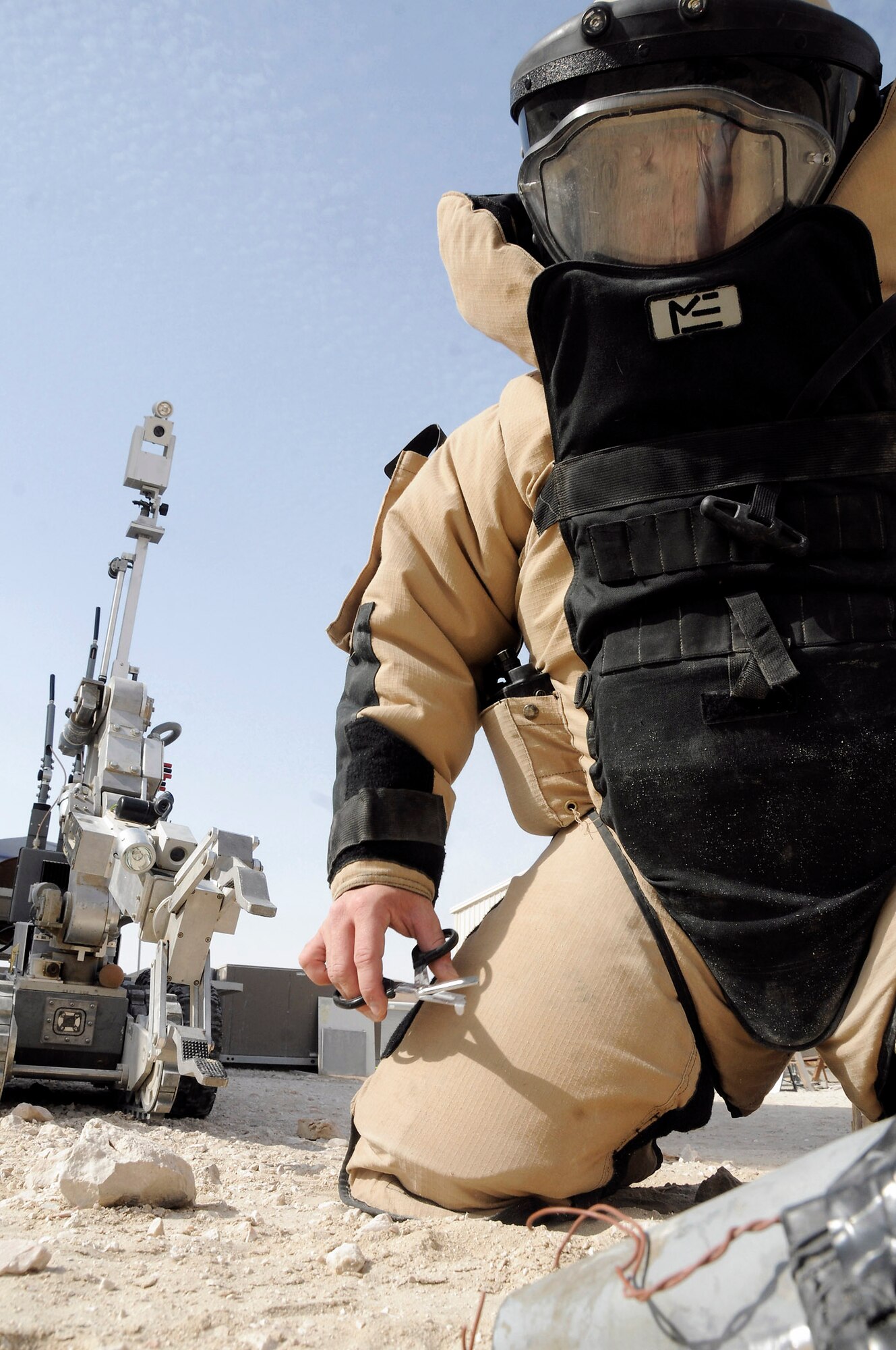 Master Sgt. John Beebe clears an improvised explosive device during training Dec. 15 at an air base in Southwest Asia. Sergeant Beebe is the Explosive Ordnance Disposal flight chief assigned to the 379th Expeditionary Civil Engineer Squadron. He is a native of Fort Lauderdale, Fla., and is deployed from Kadena Air Base, Japan. (U.S. Air Force photo/Staff Sgt. Darnell T. Cannady) 
