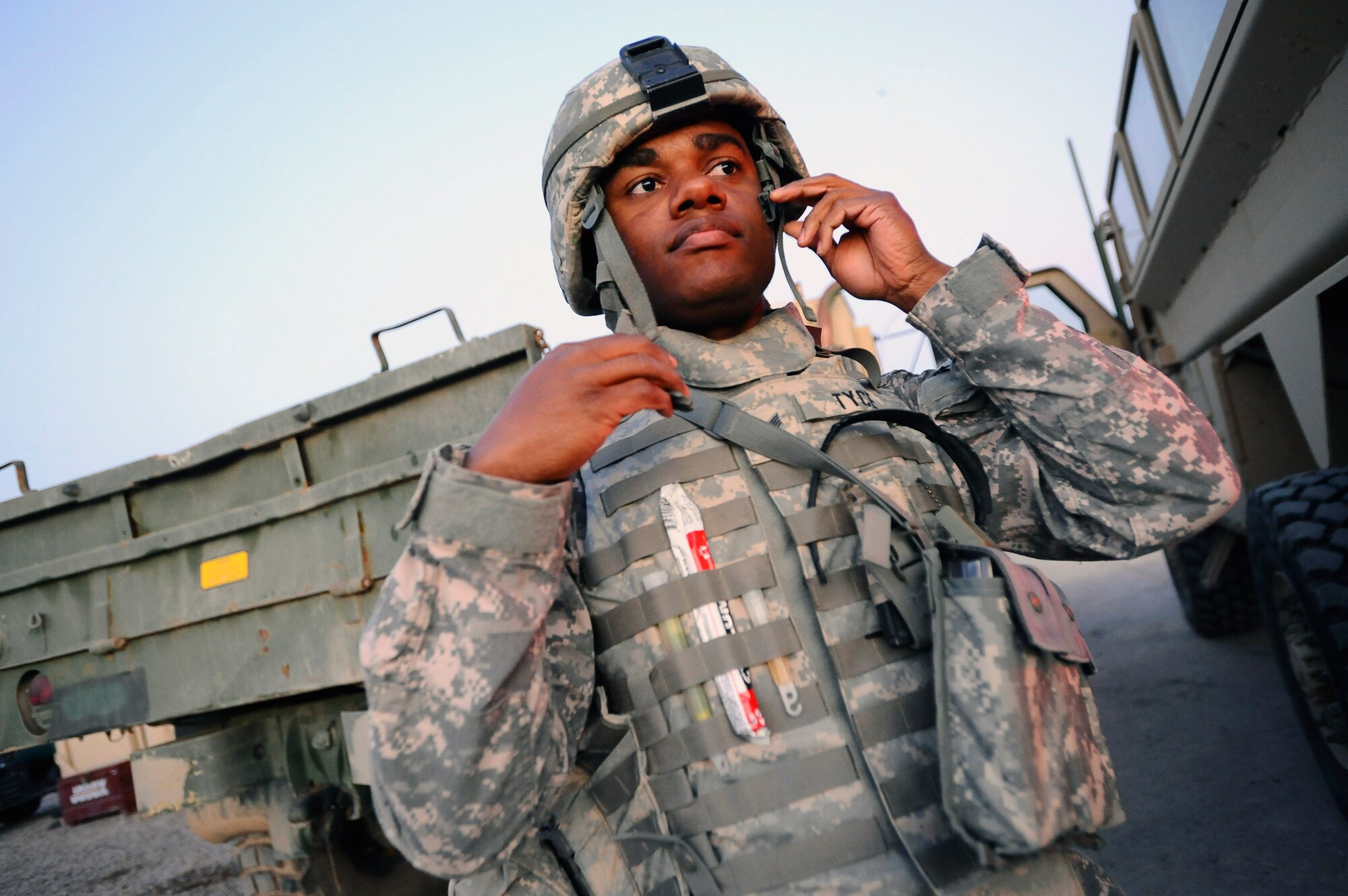 Staff Sgt. Kevin Tyce dons his individual body armor before leaving the base on an outside-the-wire mission Dec. 11 at Joint Base Balad, Iraq. Sergeant Tyce and other Airmen from the 732nd Expeditionary Civil Engineer Squadron Det. 6 undertake construction projects for the Army. Sergeant Tyce, a 732nd ECES Det. 6 electrical systems specialist and native of Oklahoma City, is deployed from Yokota Air Base, Japan. (U.S. Air Force photo/Airman 1st Class Jason Epley) 
