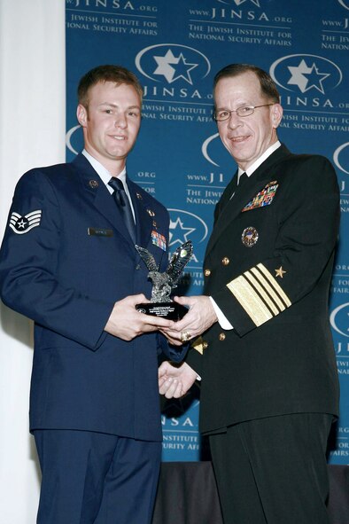 Staff Sgt. Zachary Rhyner receives the Jewish Institute for National Security Affairs Grateful Nation Award from Navy Adm. Michael C. Mullen during the Grateful Nation Award Ceremony Dec. 8 in Washington, D.C. Sergeant Rhyner is a a special tactics combat controller assigned to the 21st Special Tactics Squadron at Pope Air Force Base, N.C., and Admiral Mullen is the chairman of the Joint Chiefs of Staff. (Courtesy photo) 