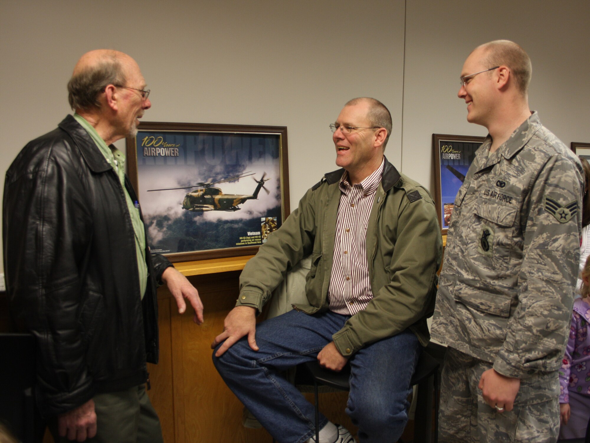WRIGHT-PATTERSON AFB, Ohio - Senior Airman Brad Scheidt, 445th Security Forces Squadron, talks with his grandfather, Tom (left) and his father, Tim (center) Dec. 20, 2008 before Airman Schedit leaves for a six month deployment to Southwest Asia.  These men represent three generations of proud Airmen serving in the Air Force.  Eighteen 445th Security Forces Squadron members deployed in December. (Air Force photo/Maj. Cynthia Harris) 