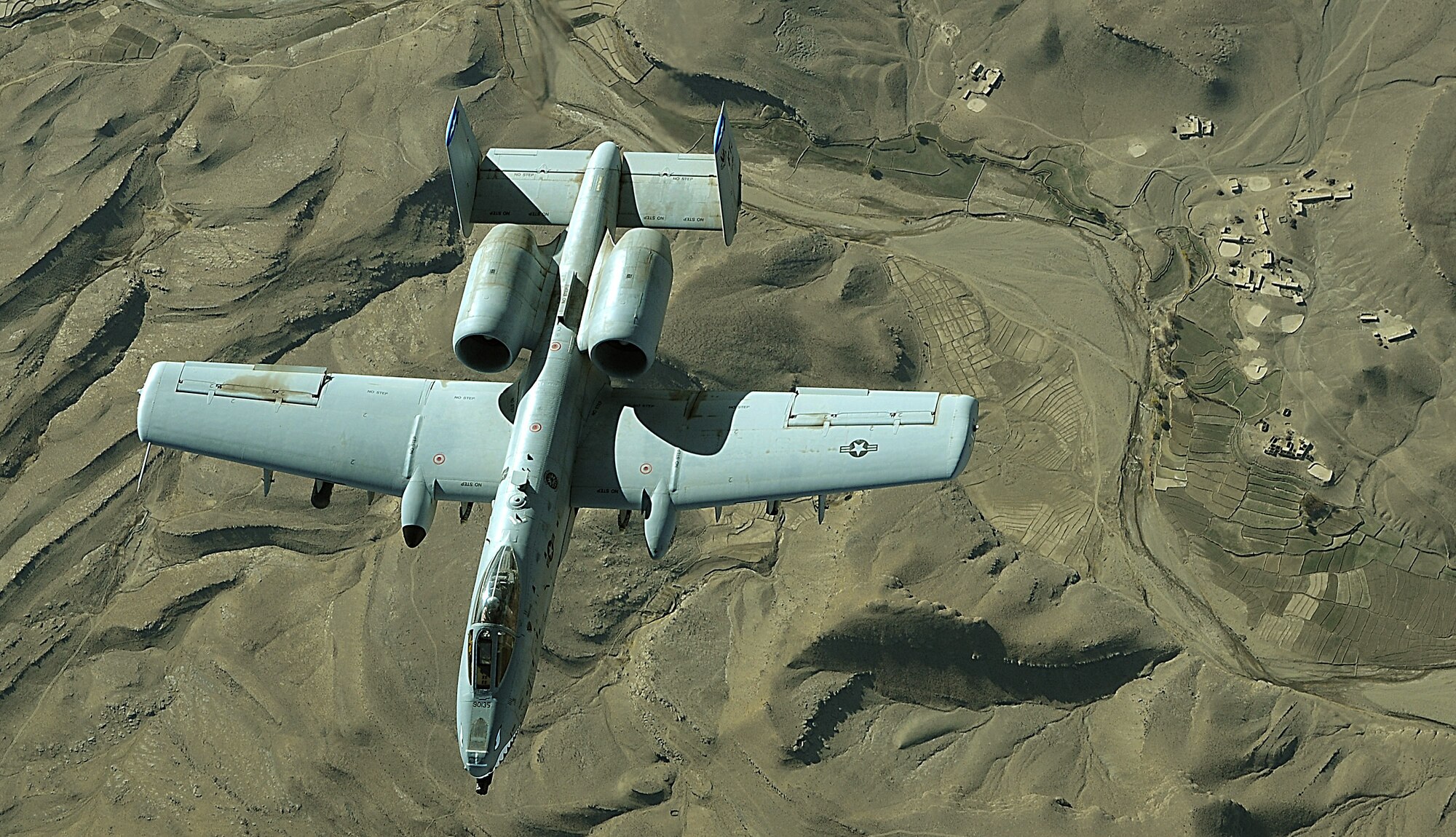An A-10 Thunderbolt II provides top cover over Afghanistan in support of coalition ground forces. A-10s conduct shows of force to deter enemy activities and provide armed aerial overwatch.  (U.S. Air Force photo/Staff Sgt. Aaron Allmon)  

