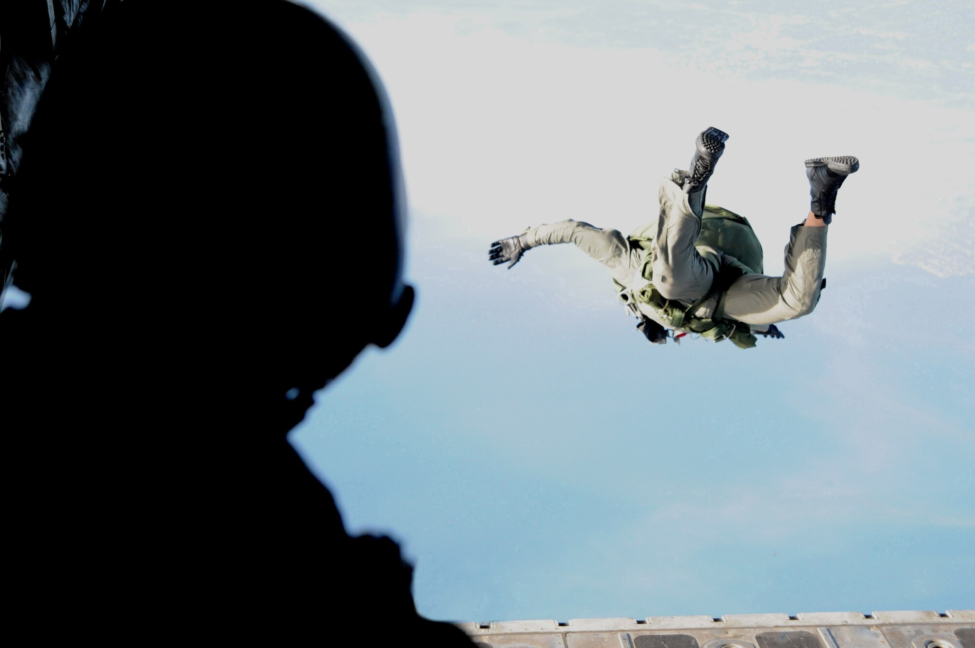A parajumper leaps from a C-130 at 10,000 feet during "Operation Toy Drop" here Dec. 18. For this event, 196 Jumpers from SOCCENT, SOCOM, JSCE, CENTCOM, SOCSOUTH and the 20th Special Forces Group donated toys to benefit the USMC Reserve Center's Toys for Tots drive. "Operation Toy Drop” jumpers had to donate toys in order to manifest for this jump. During the 59 years of the United States Marine Corps Reserve Toys for Tots Program, Marines have distributed more than 370 million toys to more than 173 million needy children. This charitable endeavor has made U.S. Marines the unchallenged leaders in looking after less fortunate children at Christmas. Over its 16 year life span, the Marine Toys for Tots Foundation has supplemented local toy collections with more than 70.2 million toys valued at more than $387 million and provided promotion and support materials valued at over $4.7 million. (U.S. Air Force photo by Staff Sgt. Ronnie Hill) 