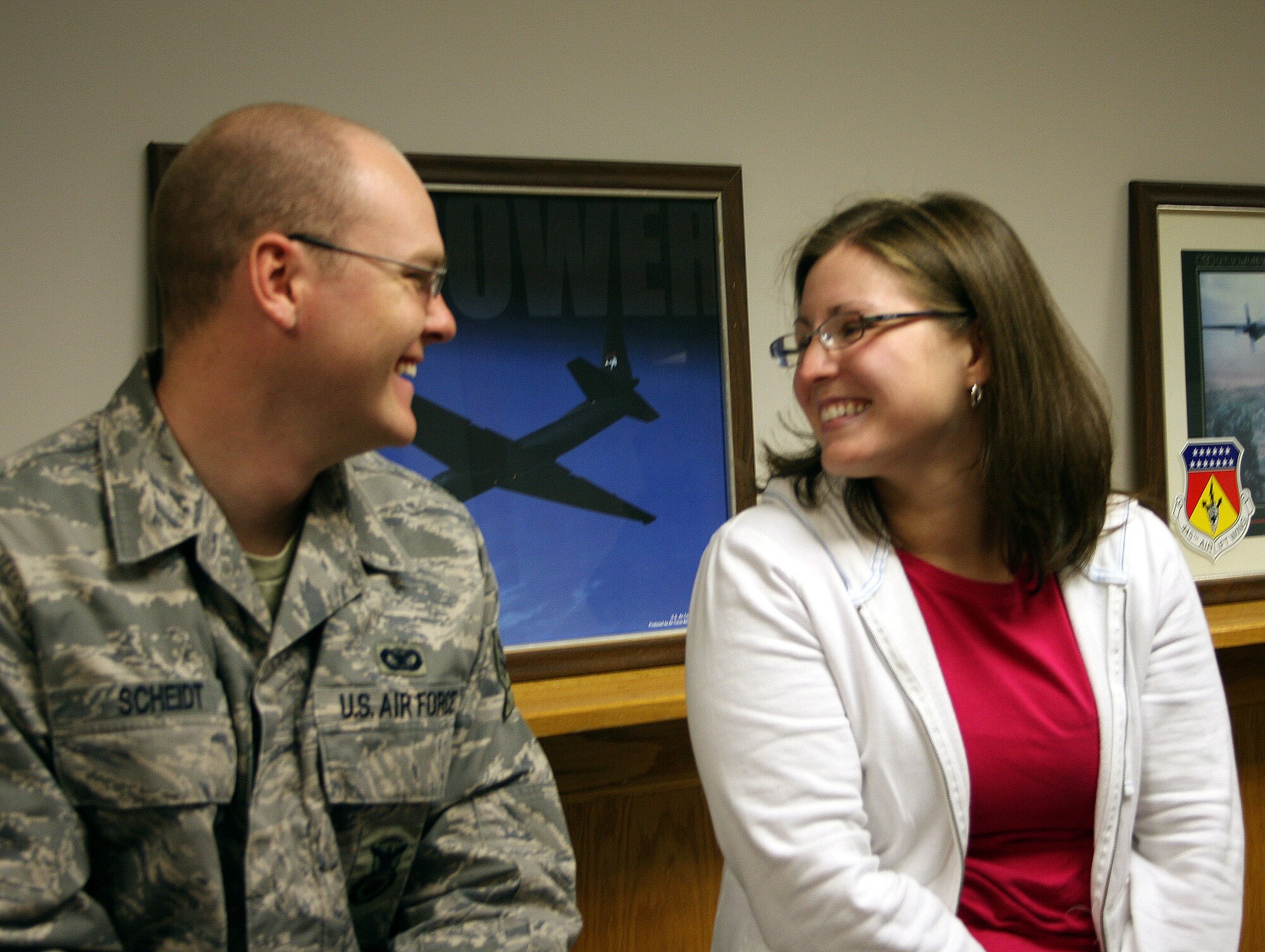 WRIGHT-PATTERSON AFB, Ohio - Senior Airman Brad Scheidt, 445th Security Forces Squadron, and his wife Danicia, spend a few moments together Dec. 20, 2008, before Airman Scheidt leaves for his six month deployment to Southwest Asia.  The 445th Security Forces Squadron had 18 members deploy in December. (Air Force photo/Maj. Cynthia Harris) 