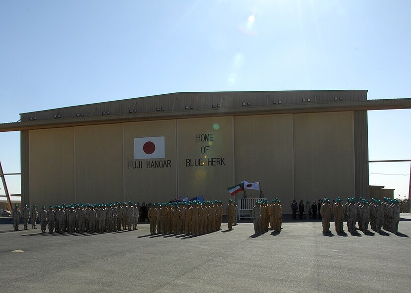 Members of the Japanese Air Self Defense Force position themselves in formation during their mission closing ceremony on Dec. 17 at an air base in Southwest Asia. The JASDF members are departing the Iraq Reconstruction Support Airlift Wing after serving alongside U.S. and coalition forces for nearly five years. (U.S. Air Force photo/Tech. Sgt. Raheem Moore)

