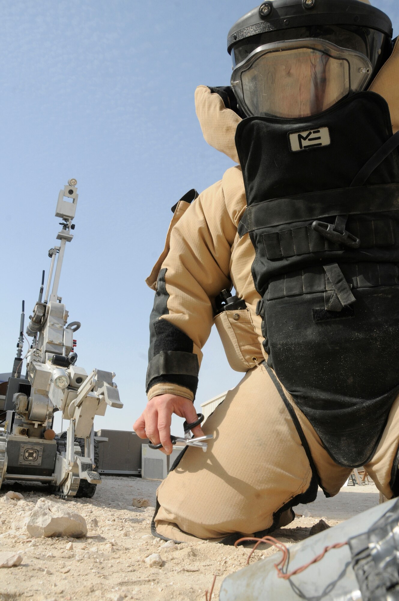 Master Sgt. John Beebe, Explosive Ordinance Disposal flight chief assigned to the 379th Expeditionary Civil Engineer Squadron, clears an improvised explosive device Dec. 15, 2008, at an undisclosed air base in Southwest Asia. EOD members are responsible for removing IEDs from the battlefield, saving the lives of those supporting the Global War on Terror. Sergeant Beebe, a native of Fort Lauderdale, Fla., is deployed from Kadena Air Base, Japan. (U.S. Air Force photo by Staff Sgt. Darnell T. Cannady)