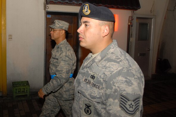 MISAWA AIR BASE, Japan -- Tech. Sgt. Alberto Aleman, 35th Security Forces Squadron, and Capt. Arturo Maloco, 35th Aerospace Medicine Squadron, provide a highly visible presence on the streets of Misawa City during a town patrol Sept. 13, 2008. Town patrol is conducted on Friday and Saturday nights. (U.S. Air Force photo by Airman 1st Class Jamal D. Sutter)