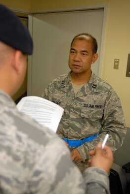 MISAWA AIR BASE, Japan -- Capt. Arturo Maloco, 35th Aerospace Medicine Squadron, receives a town patrol brief from Tech. Sgt. Alberto Aleman, 35th Security Forces Squadron, Sept. 13, 2008. During the brief, Captain Maloco was given guidelines on what he should and shouldn't do and what his role is during the patrol around Misawa City. (U.S. Air Force photo by Airman 1st Class Jamal D. Sutter)