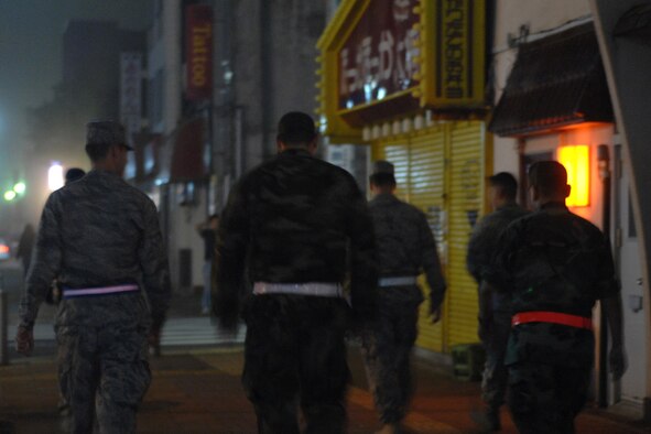 MISAWA AIR BASE, Japan -- Members of the 35th Communications Squadron walk the streets of Misawa City during town patrol Sept 6, 2008. Squadrons around base volunteer every week to augment security forces in their town patrol duties. (U.S. Air Force photo by Staff Sgt. Araceli Alarcon)