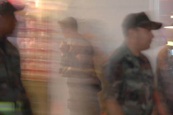 MISAWA AIR BASE, Japan -- Staff Sgt. Michael Yurco stands watch as volunteers from the 35th Communications Squadron walk by local bars during town patrol Sept 6, 2008. Squadrons around base volunteer every week to augment security forces in their town patrol duties. (U.S. Air Force photo by Staff Sgt. Araceli Alarcon)