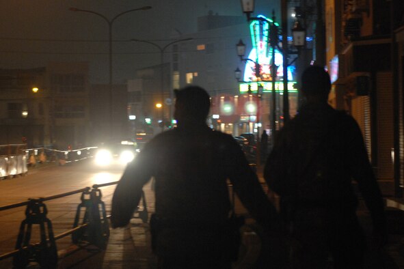 MISAWA AIR BASE, Japan -- Staff Sgt. Derrick Santos and Staff Sgt. Michael Yurco, 35th Security Forces Squadron, patrol local bars outside the gates Sept 6, 2008. Town patrol is conducted every Friday and Saturday night. (U.S. Air Force photo by Staff Sgt. Araceli Alarcon)