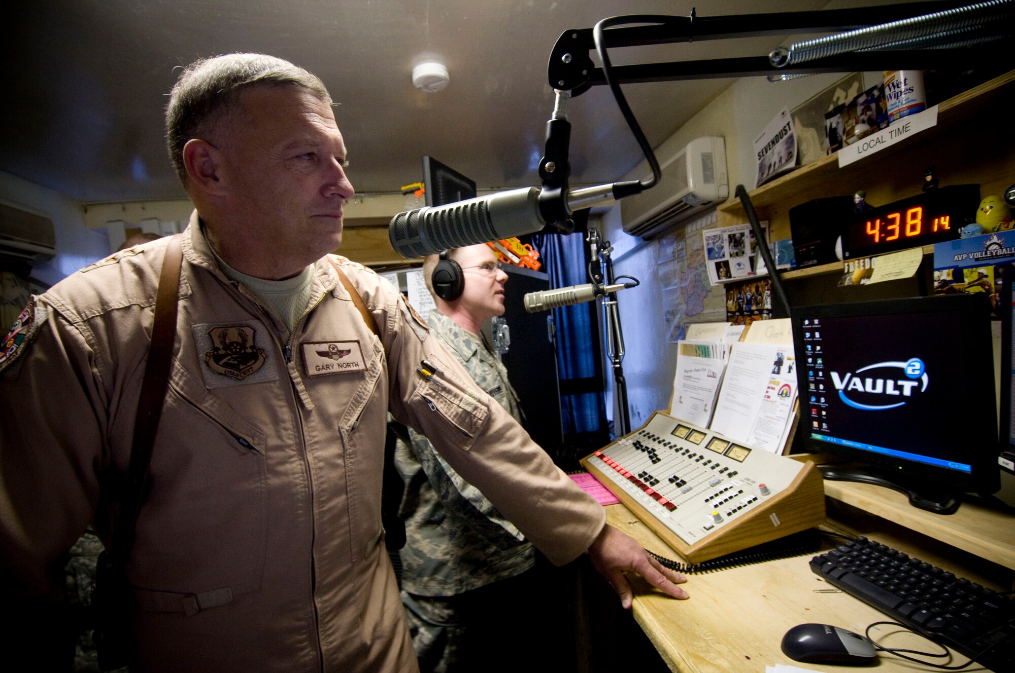 Lt. Gen. Gary North, U.S. Air Forces Central commander, delivers a holiday greeting, thanking Airmen for their service, over American Forces Network radio at Bagram Air Field, Afghanistan, Christmas Eve, Dec. 24. He was introduced by Staff Sgt. Jeffery St. Sauveur. (U.S. Air Force photo by Staff Sgt. Samuel Morse)(Released)